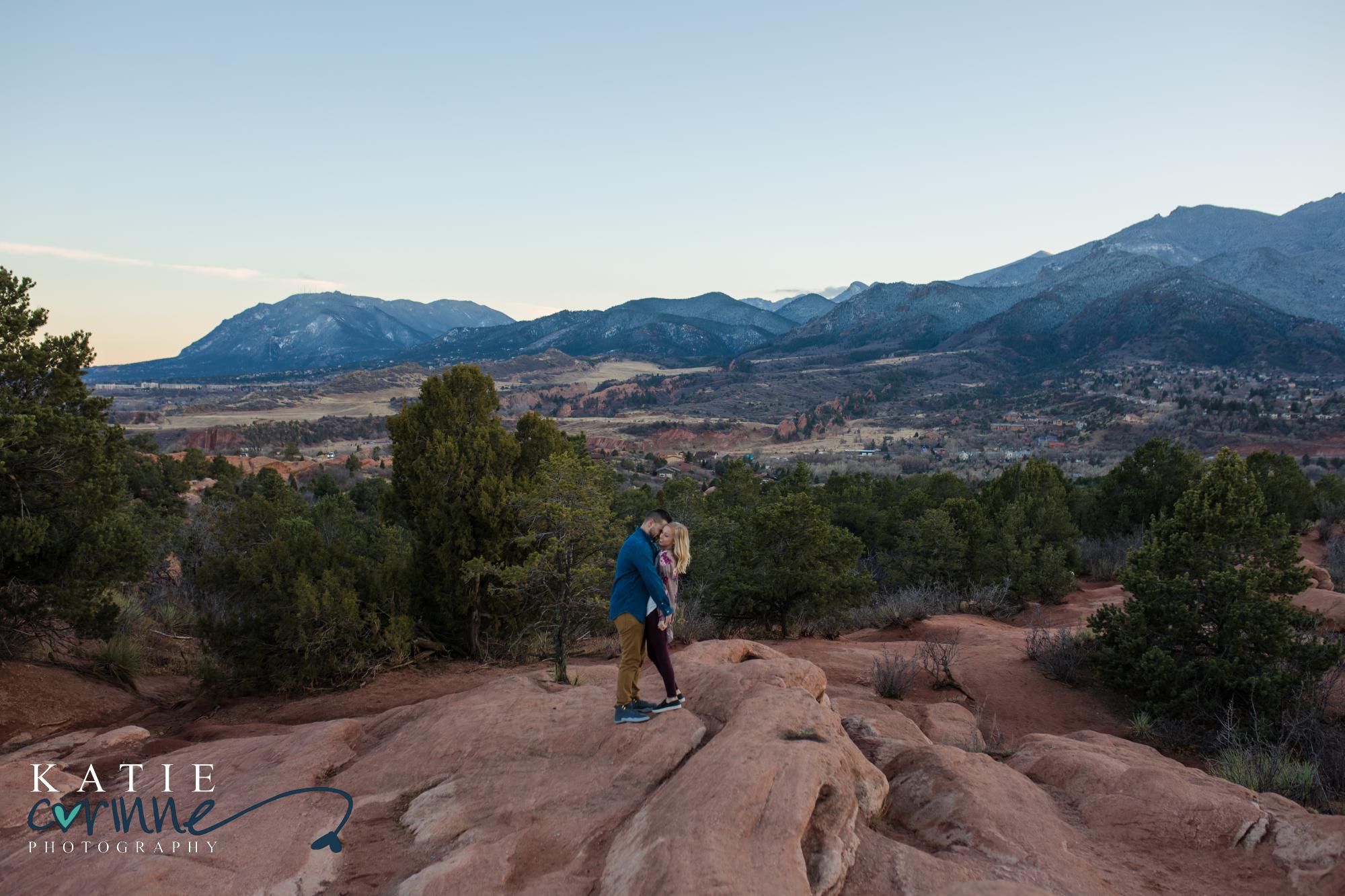 Couple kiss after surprise mountain proposal in colorado springs