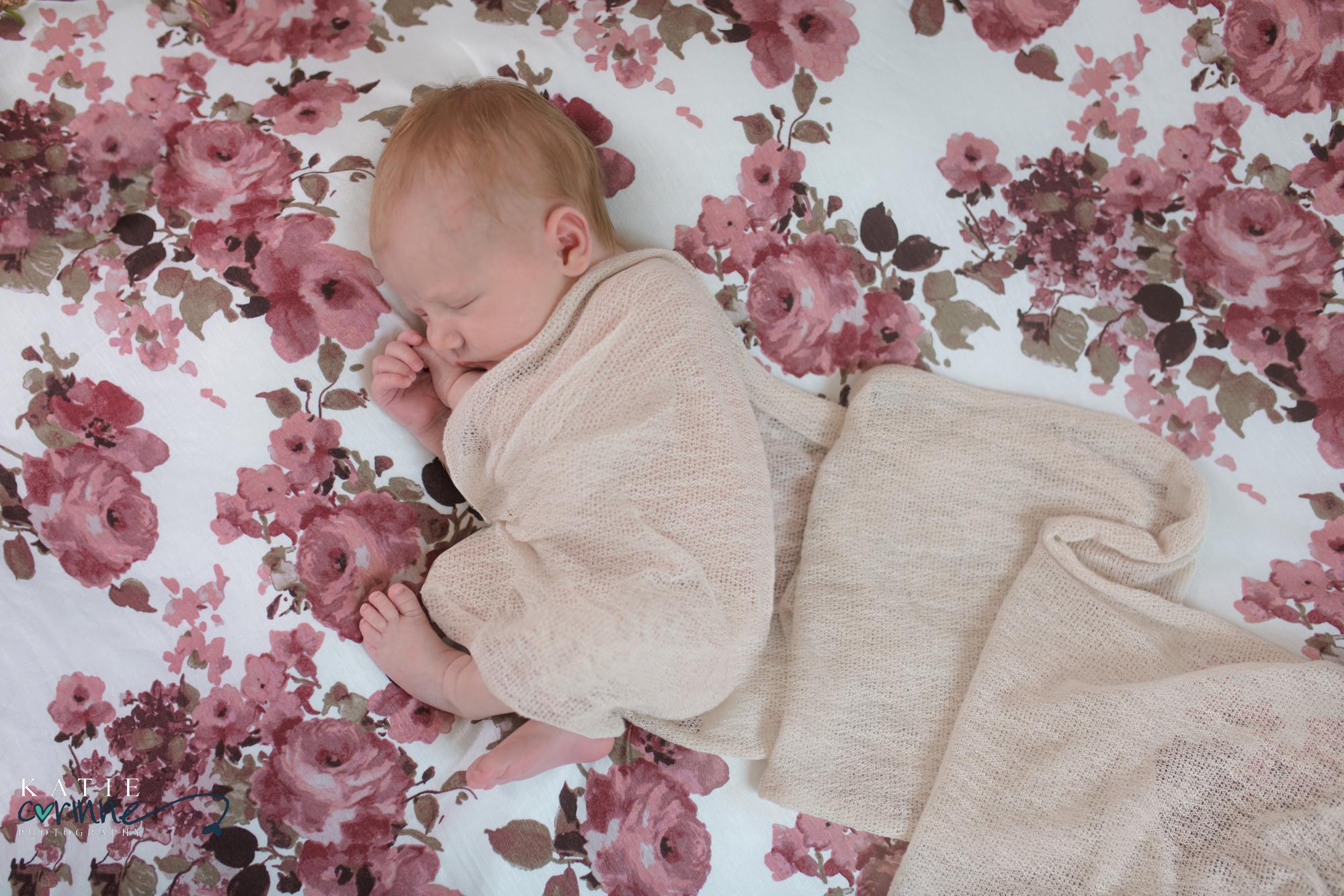 Destination newborn photographer poses baby girl