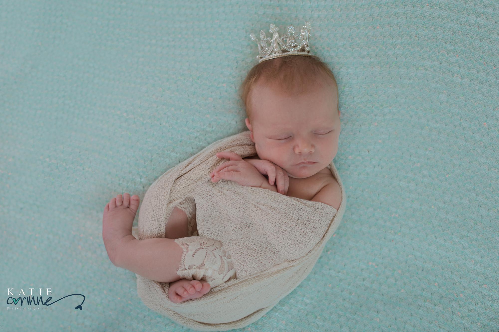 Baby girl wearing princess crown