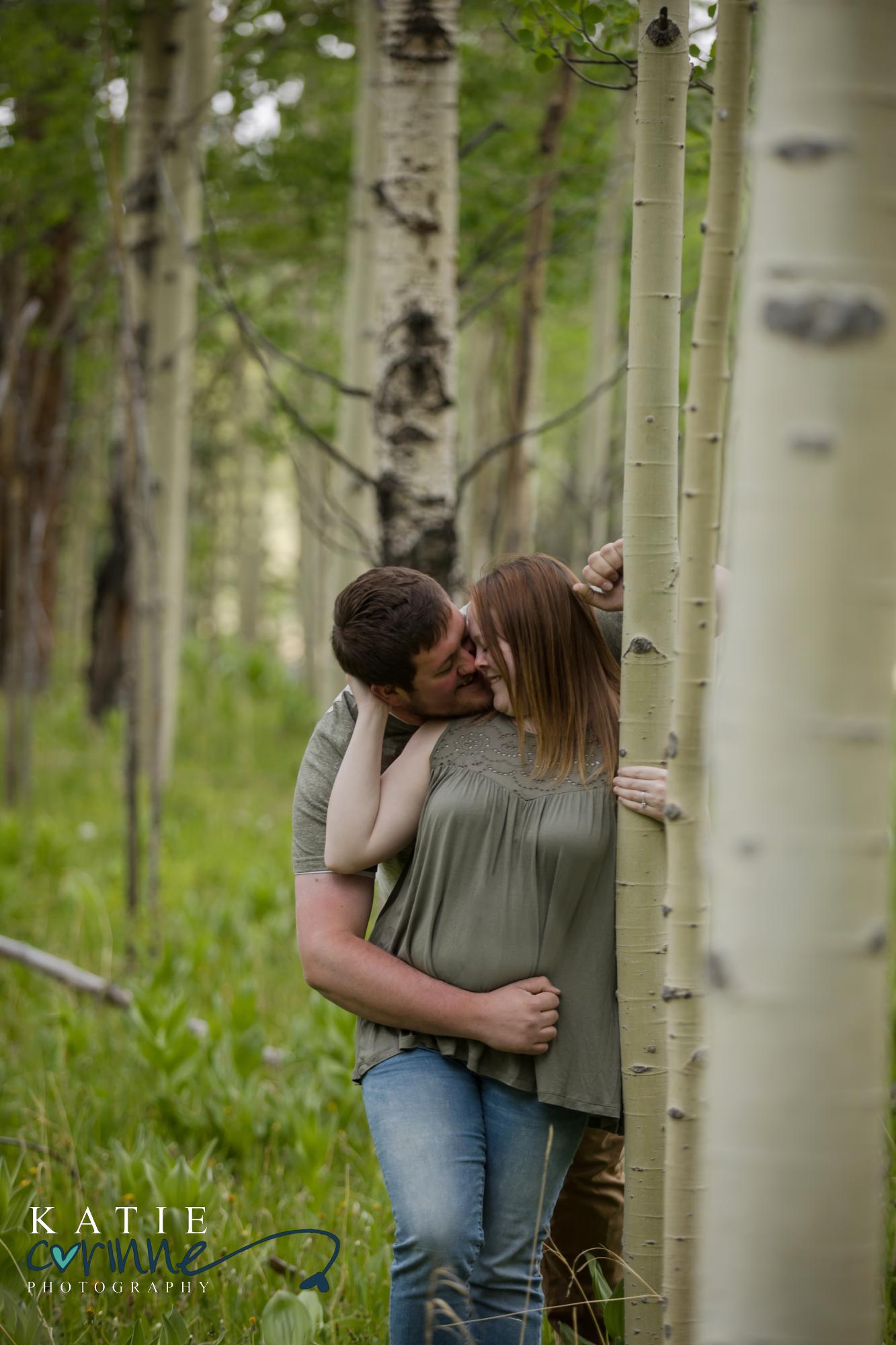 engaged couple pose for Colorado Springs photographer