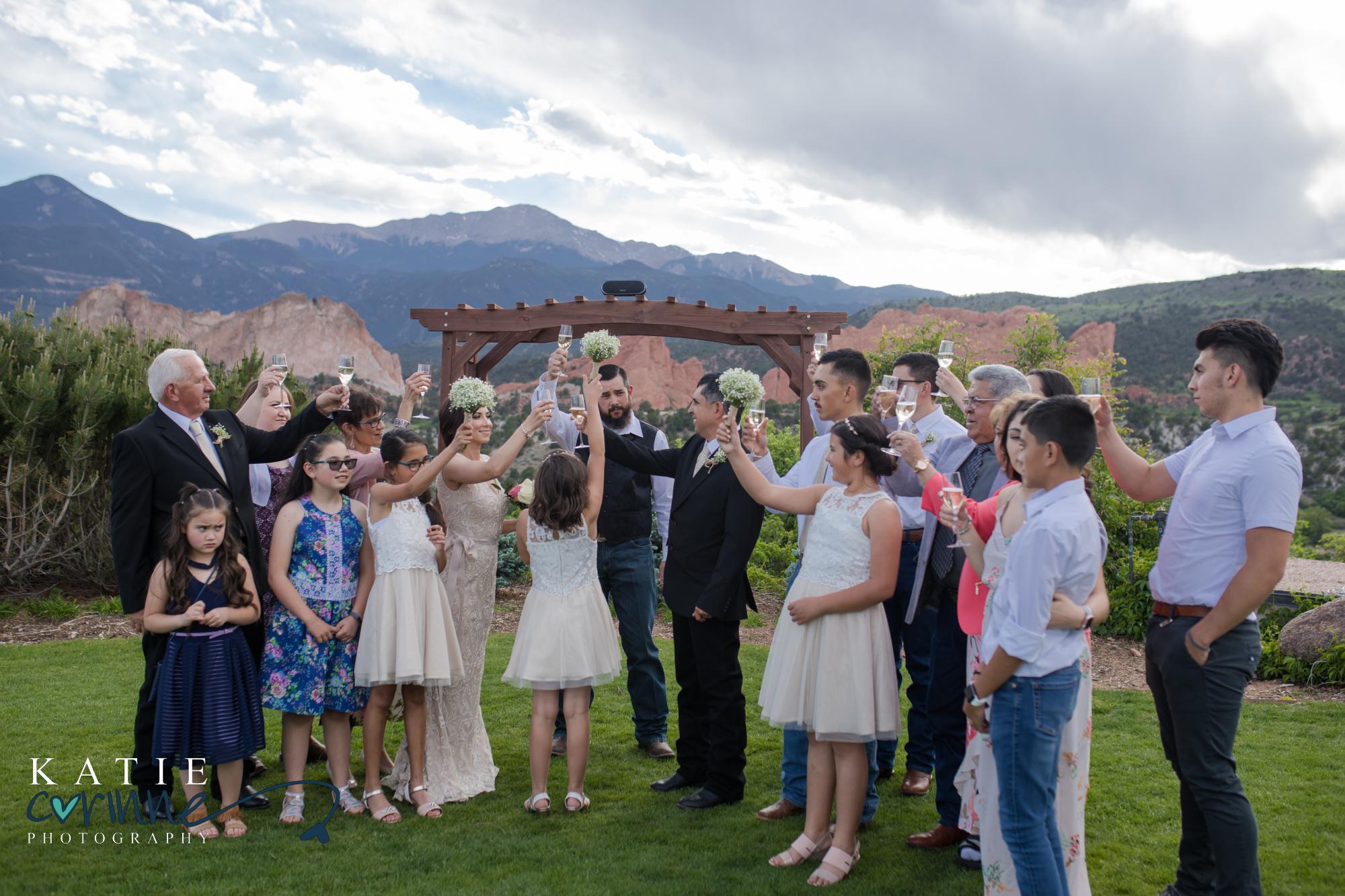 Wedding guests cheers bride and groom