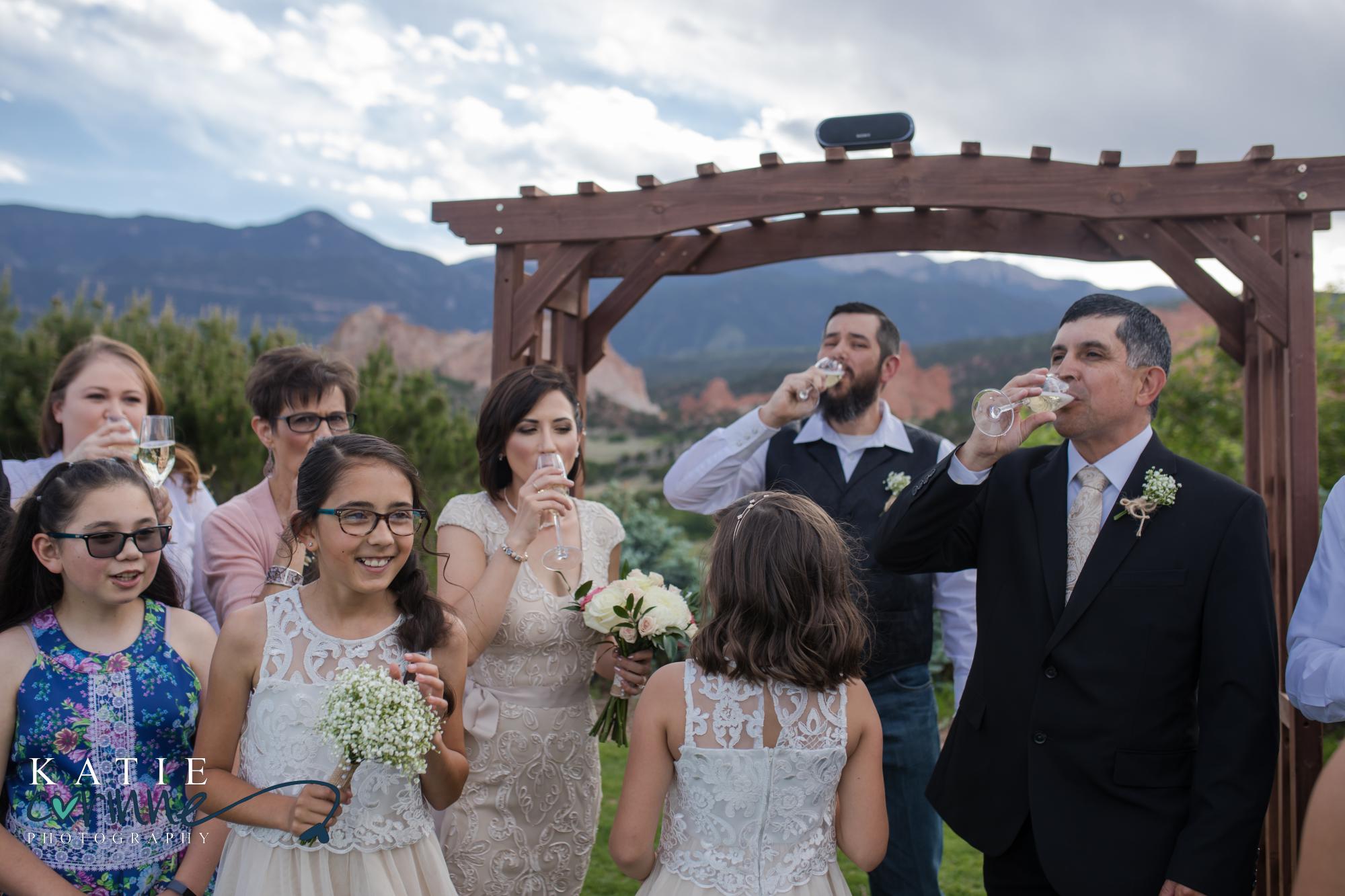 Colorado Springs Wedding guests cheers bride and groom