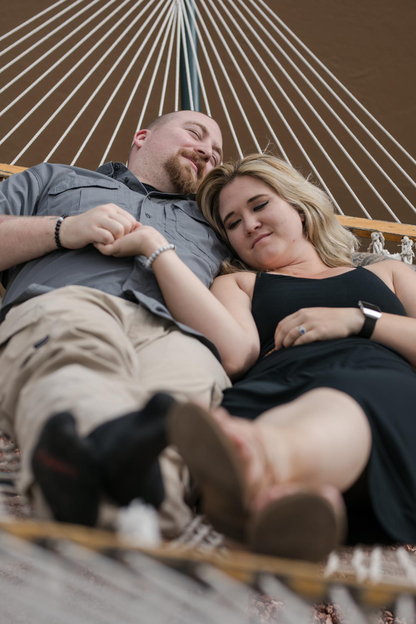 Colorado couple on hammock being photographed