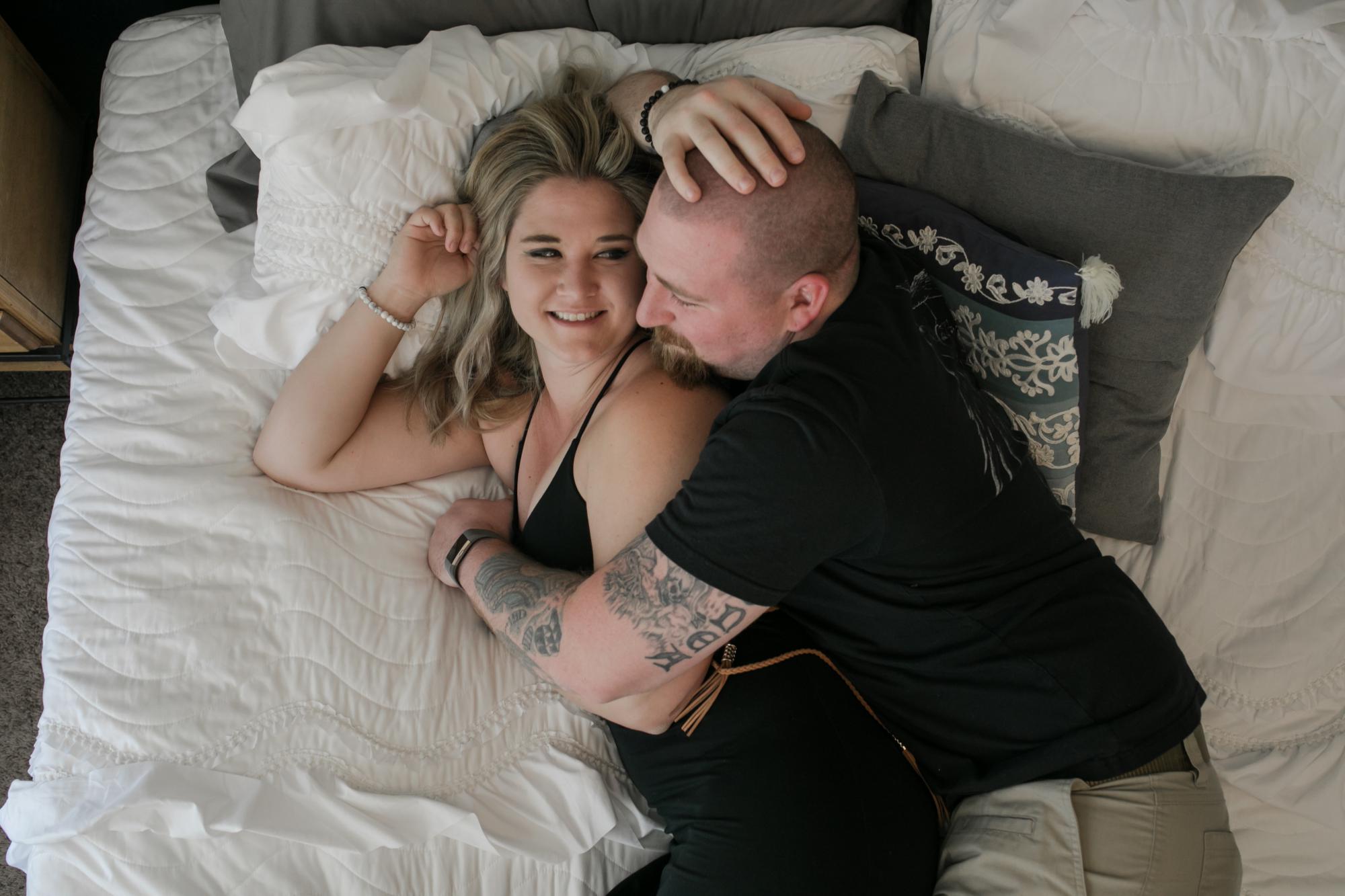 Colorado Springs couple cuddles during lifestyle engagement session