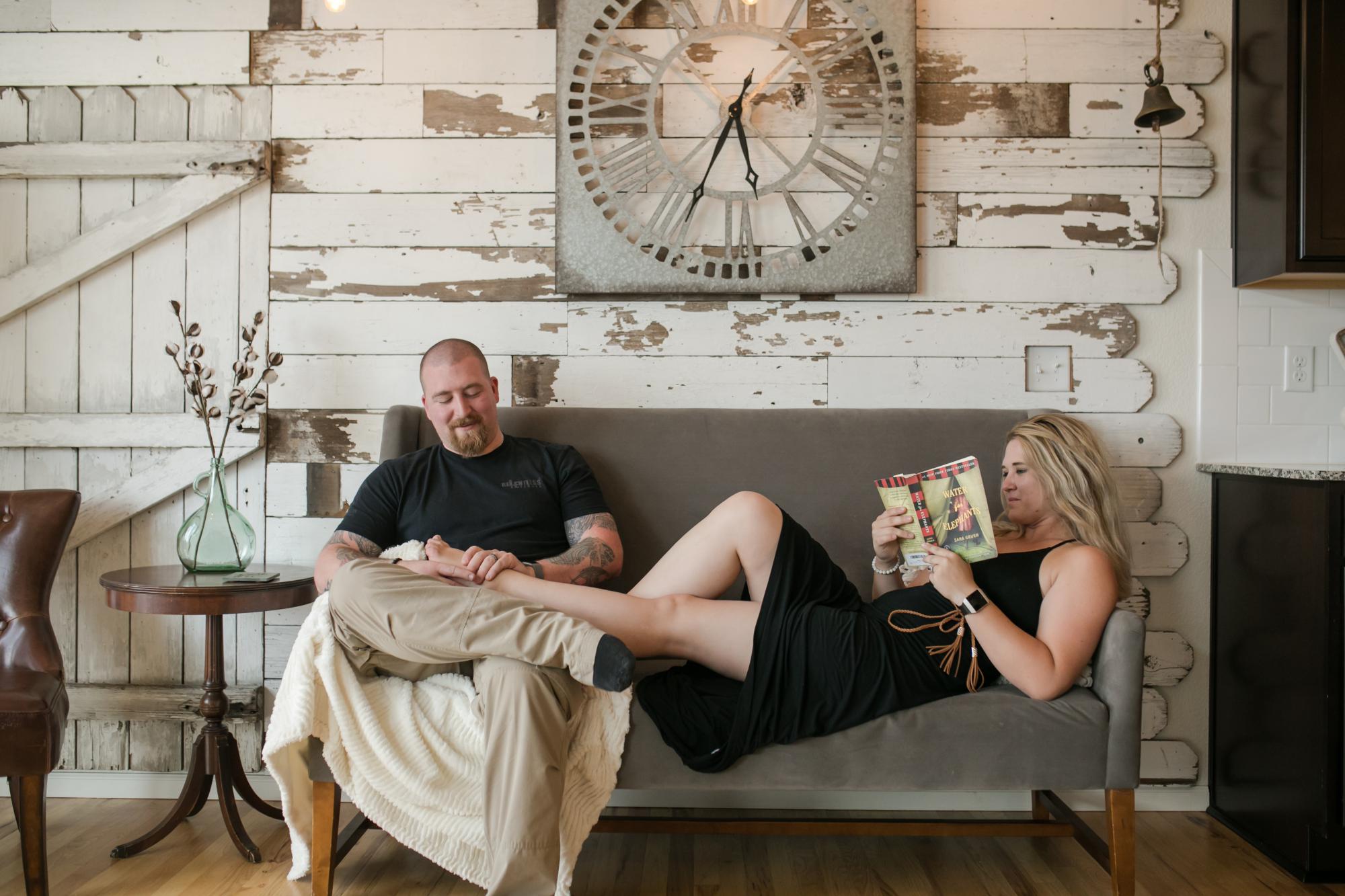 couple relaxes on couch in Colorado Springs home