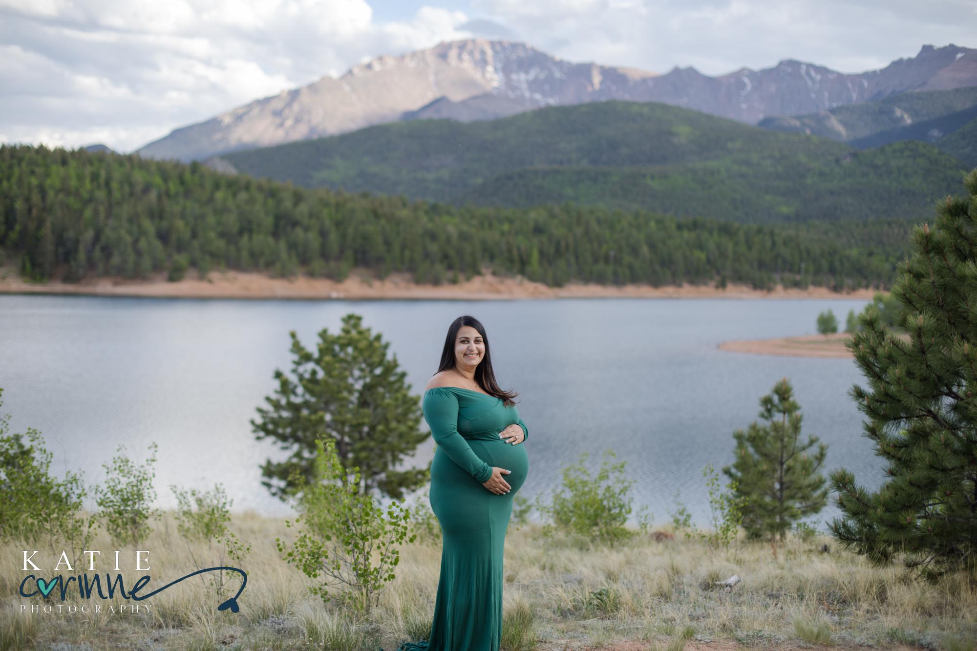 Expectant mother in front of Rocky Mountains and Crystal Reservoir