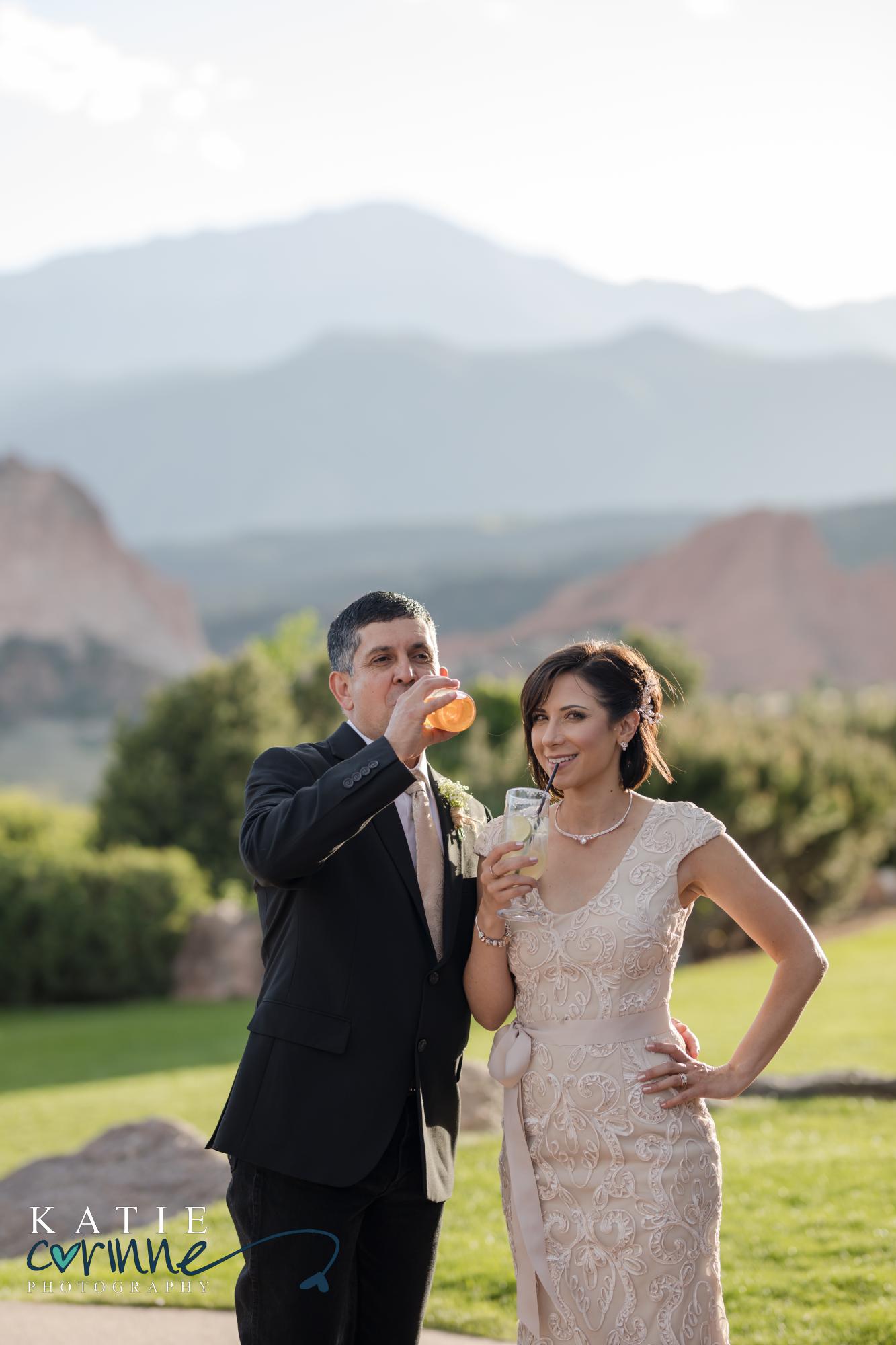 bride and groom cheers at destination mountain elopement