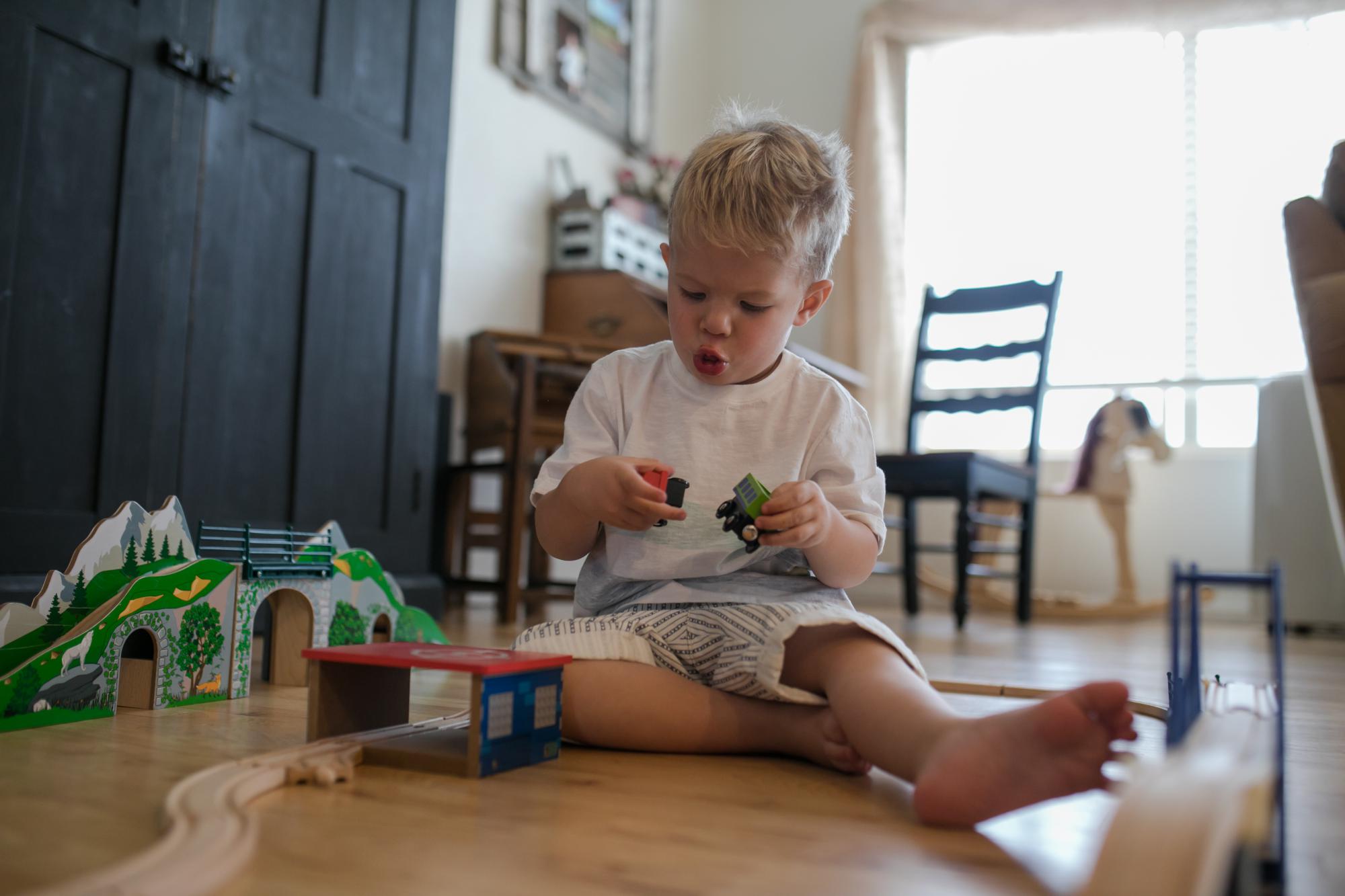 Young boy playing with toy in Colorado home