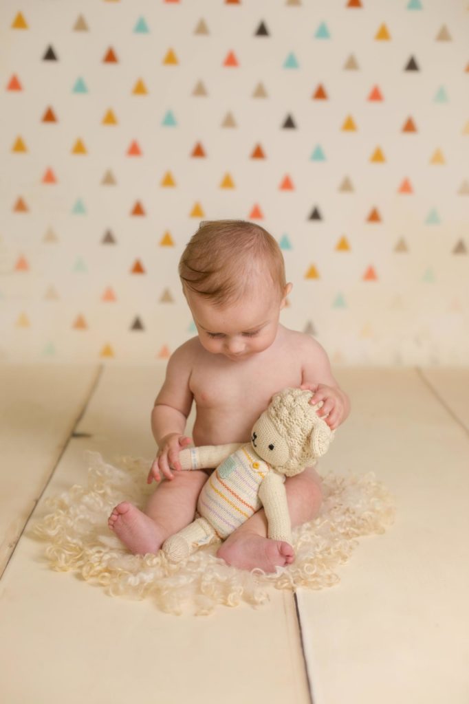 six month old poses for Colorado family photographer