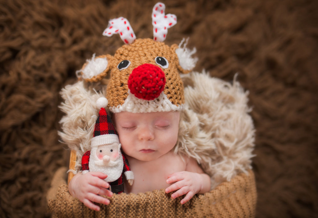 baby in reindeer rudolph outfit and mini Santa