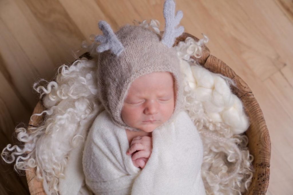 reindeer newborn baby boy Christmas photo neutral colors