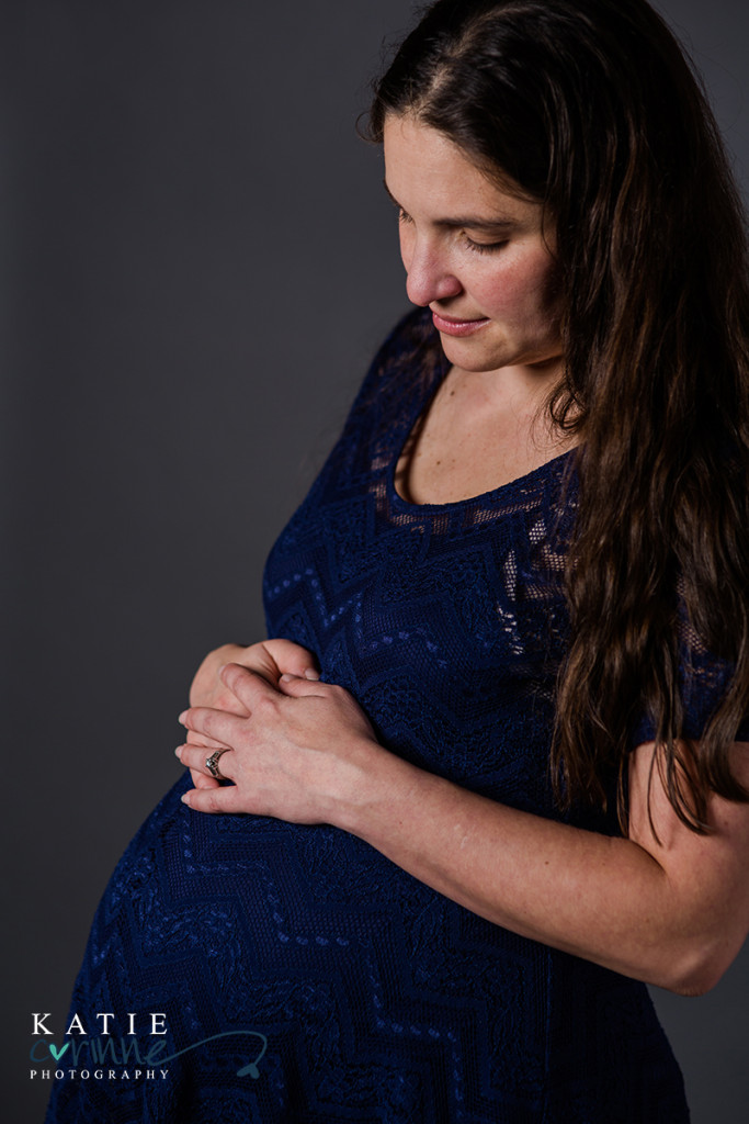 Blue maternity dress and pregnant woman studio photographer