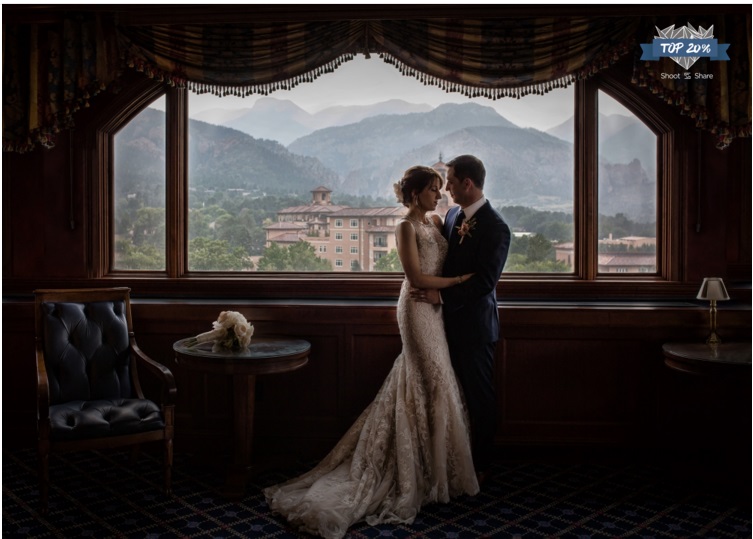 Award winning Colorado Springs wedding photographer, bride and groom at the Broadmoor Penrose Room on wedding day, silhouette of couple at the Broadmoor