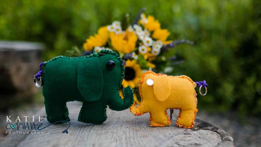 Make sure to include details that you love when wedding planning, like these two fabric elephants! 