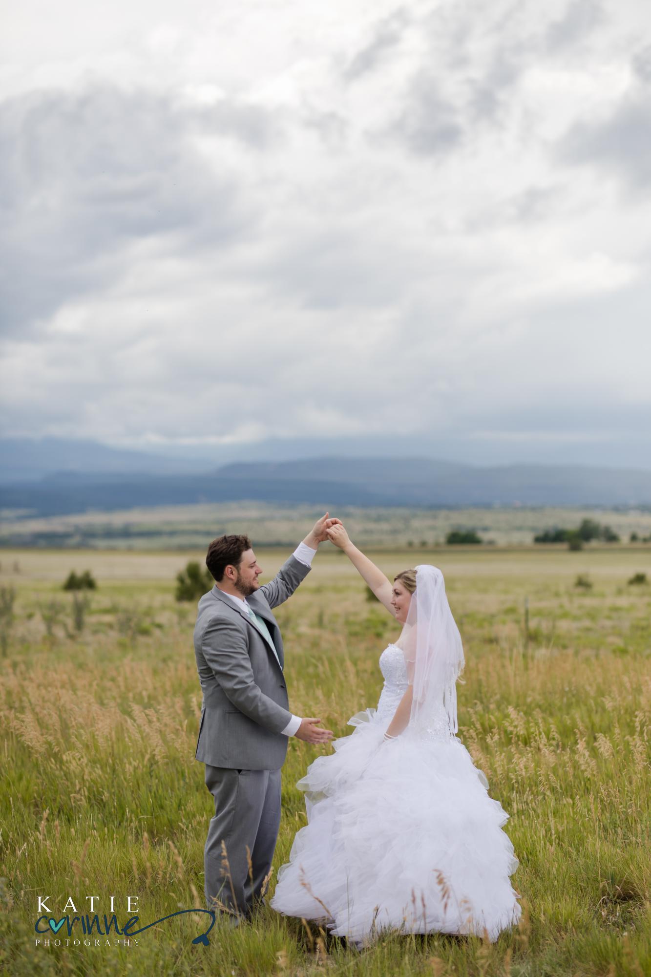 Bride and Groom dancing in Colorado field