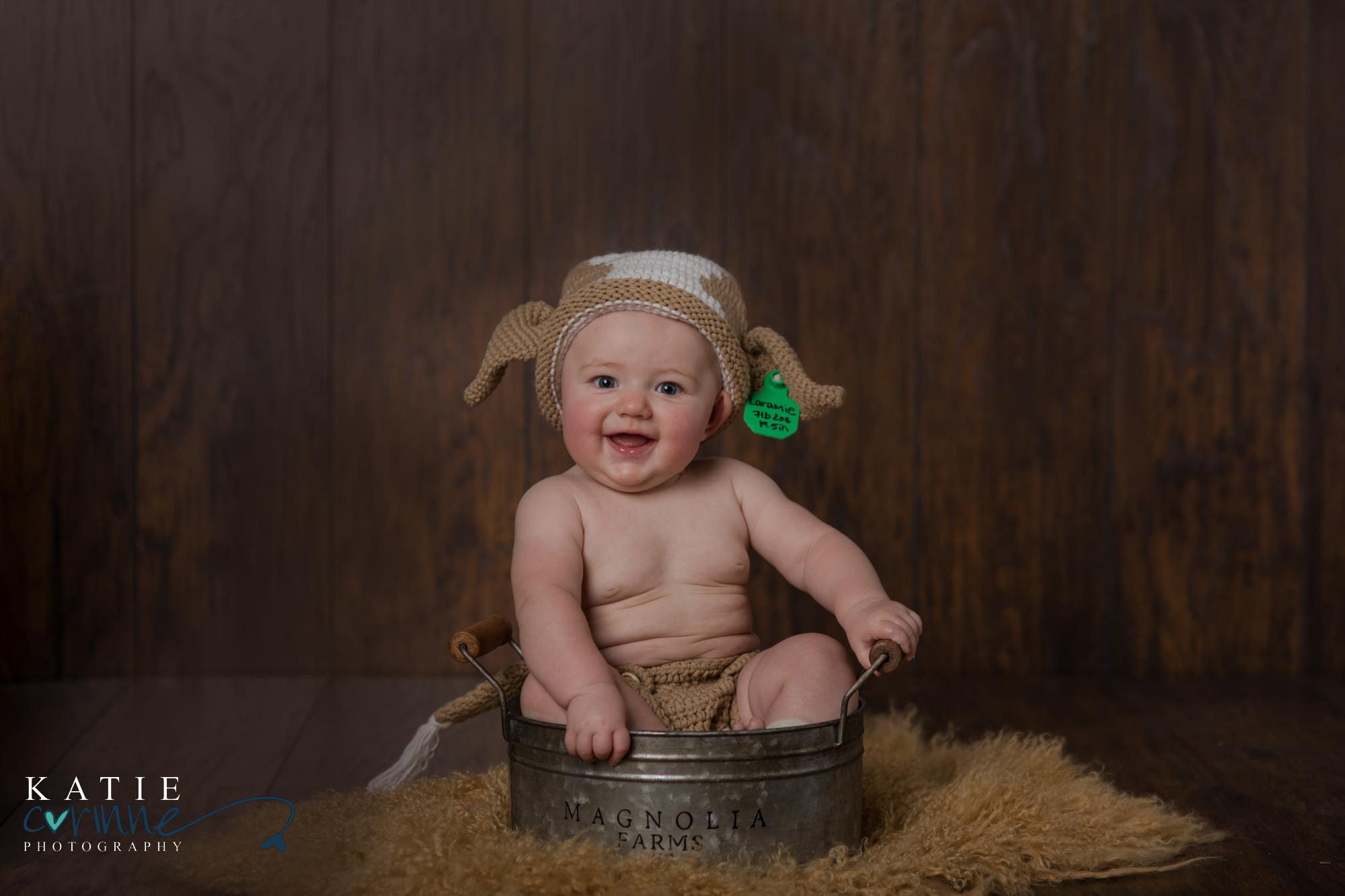 Cow hat at baby milestone session