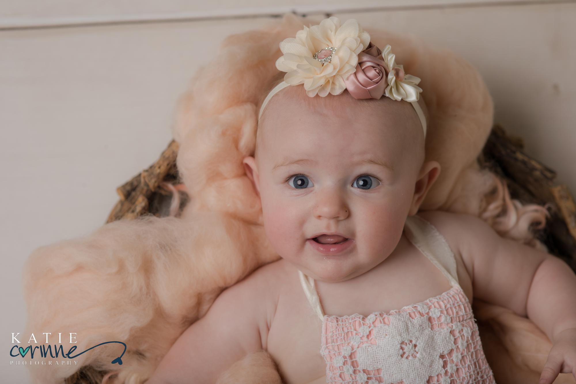 6 month old baby with bow on head