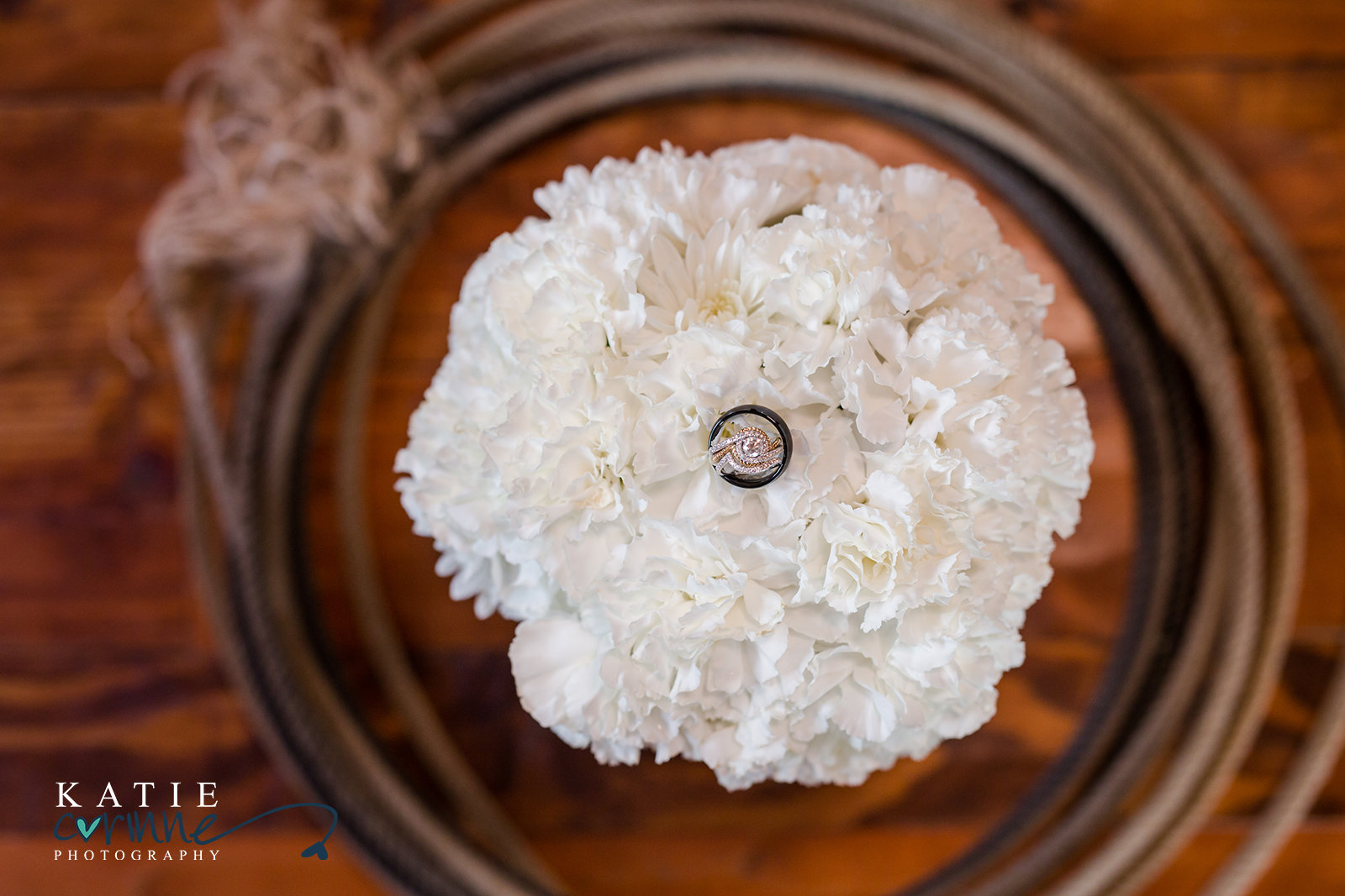 wedding rings flowers and rope
