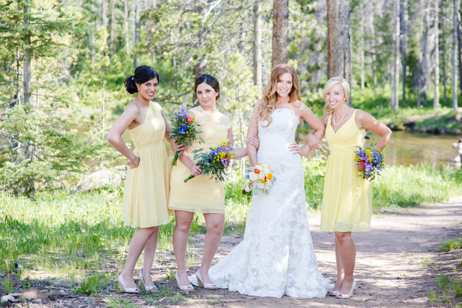 Bridesmaids in yellow dresses at piney river ranch