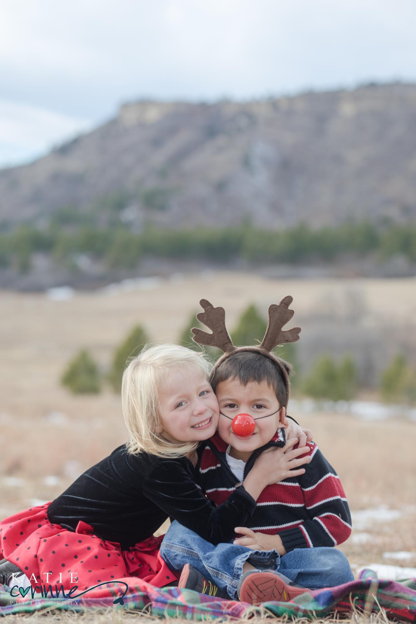 siblings make funny poses in Christmas attire