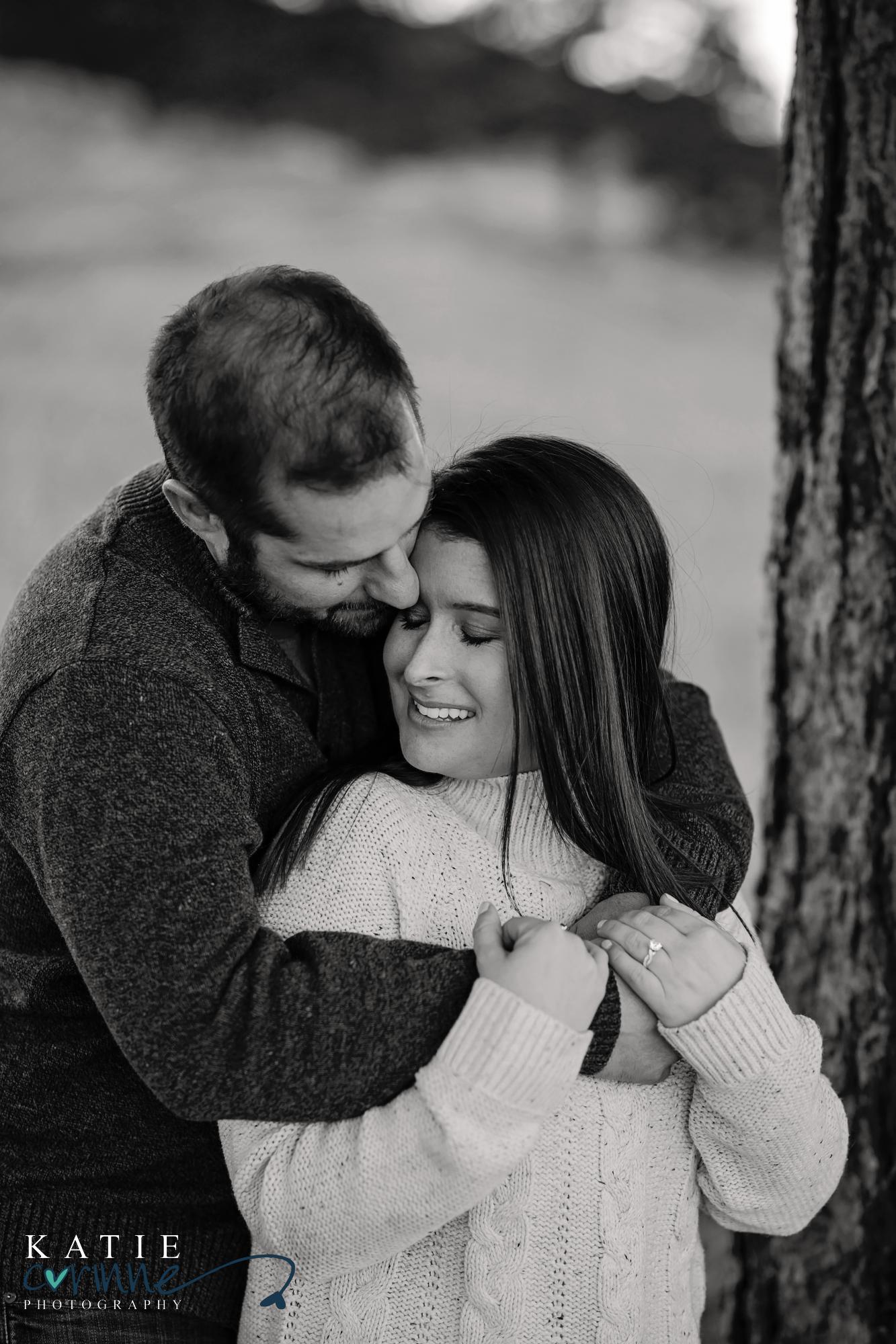 couples hold each other at Evergreen Engagement session