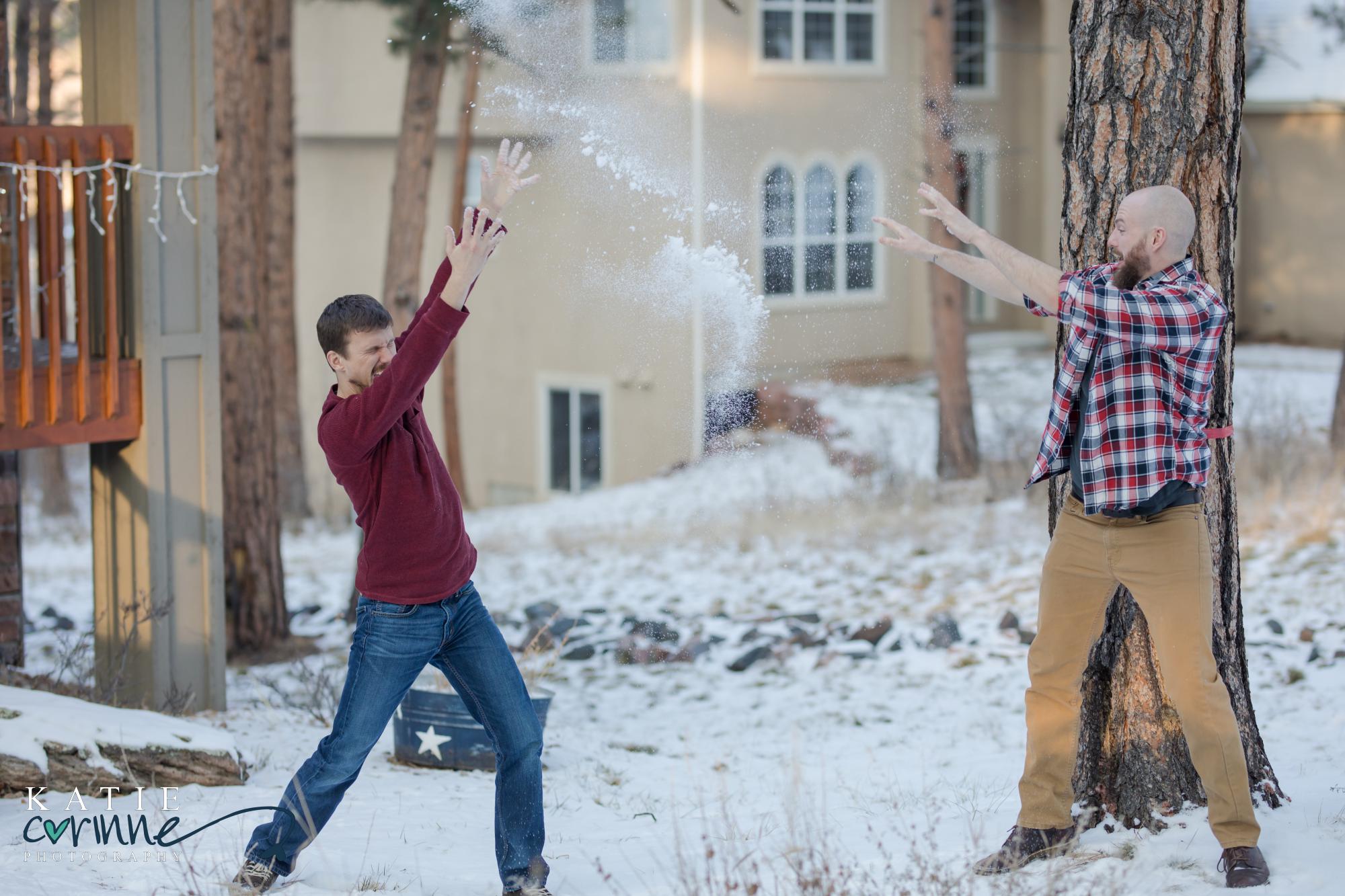 two adult brother have Snowball Fight in colorado