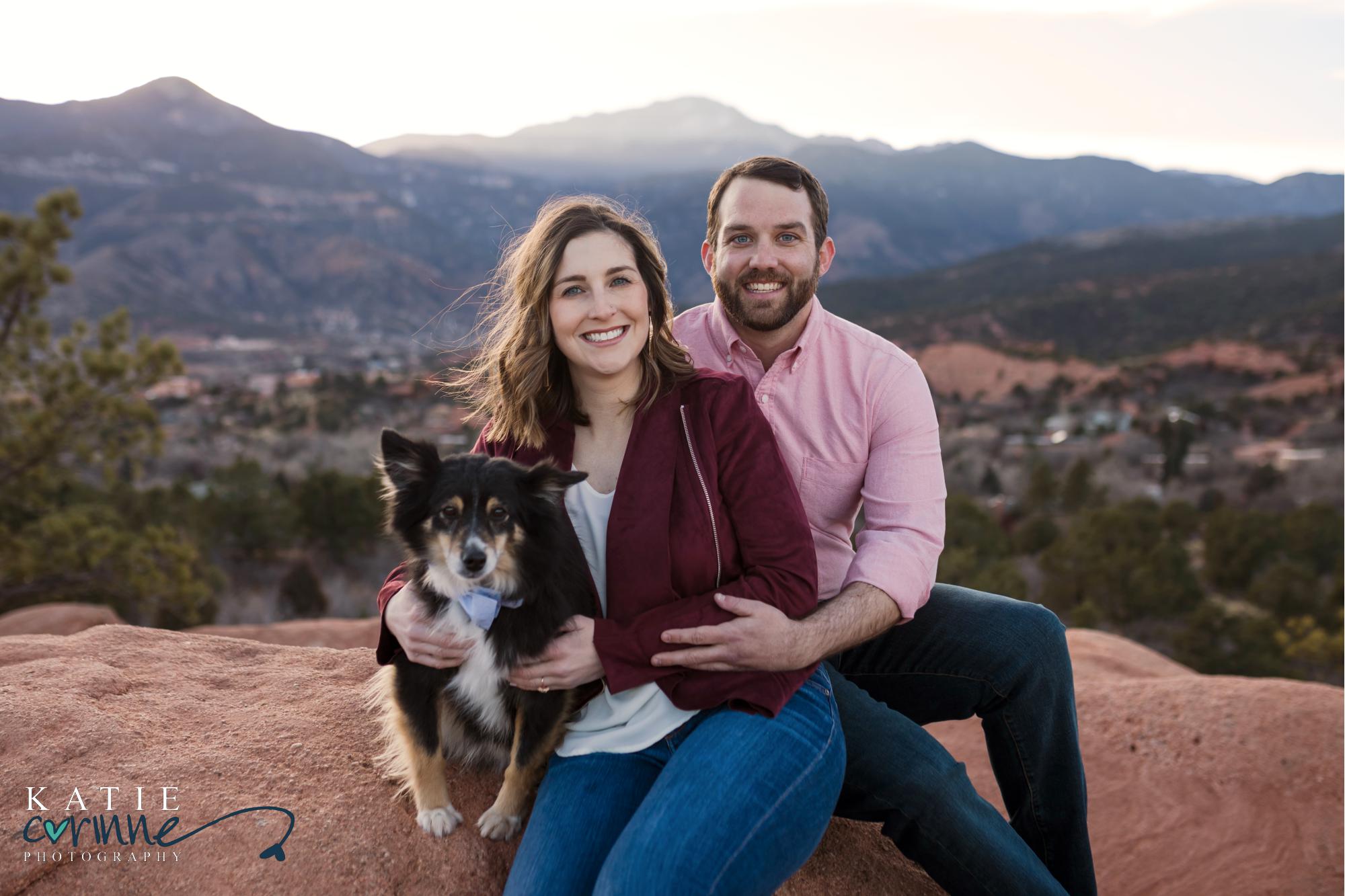 couple poses with gods in front of Rocky Mountains in Colorado