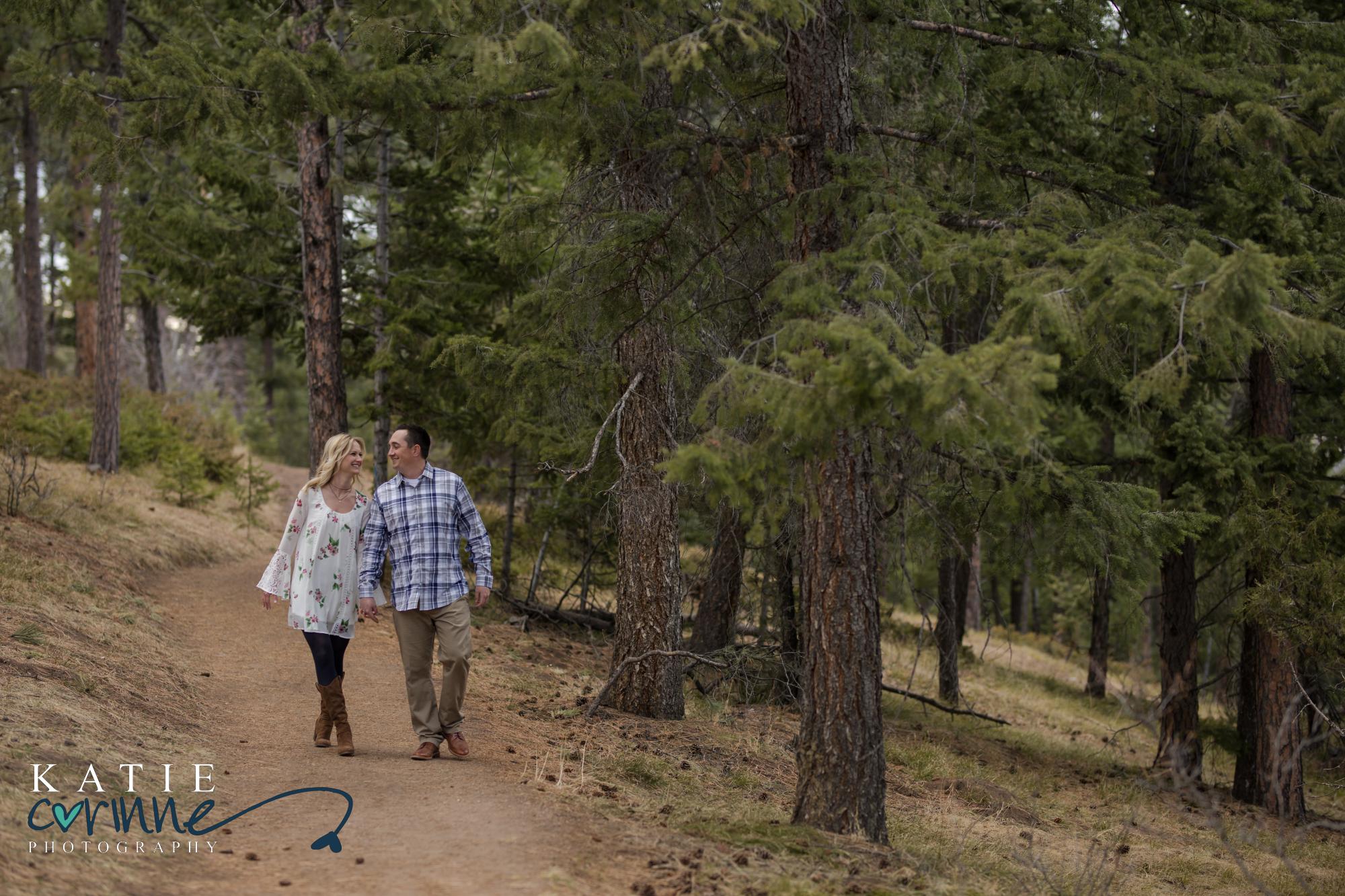 cute couple walking along Mount Falcon trail