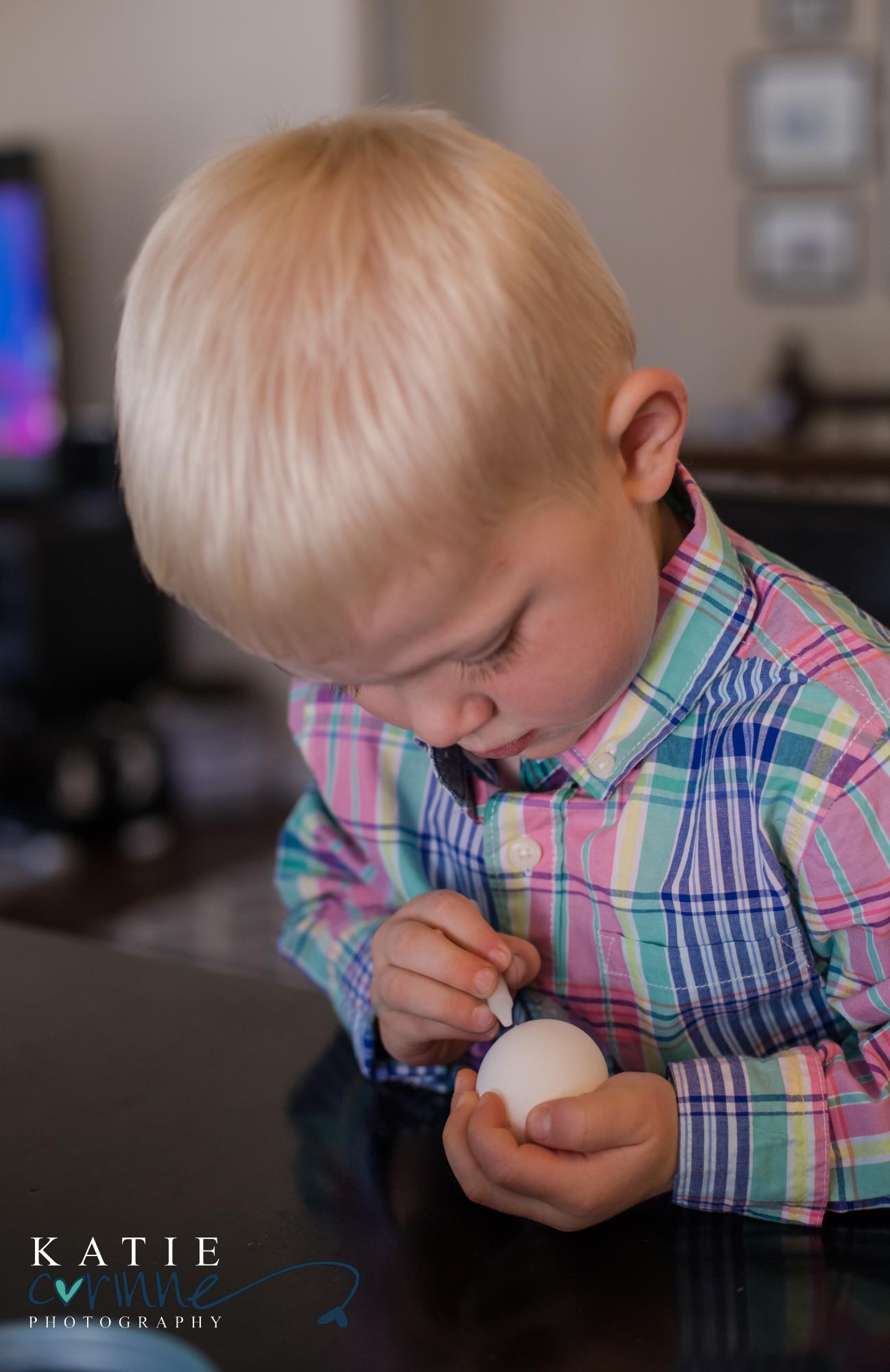 Colorado boy writes on egg with white crayon