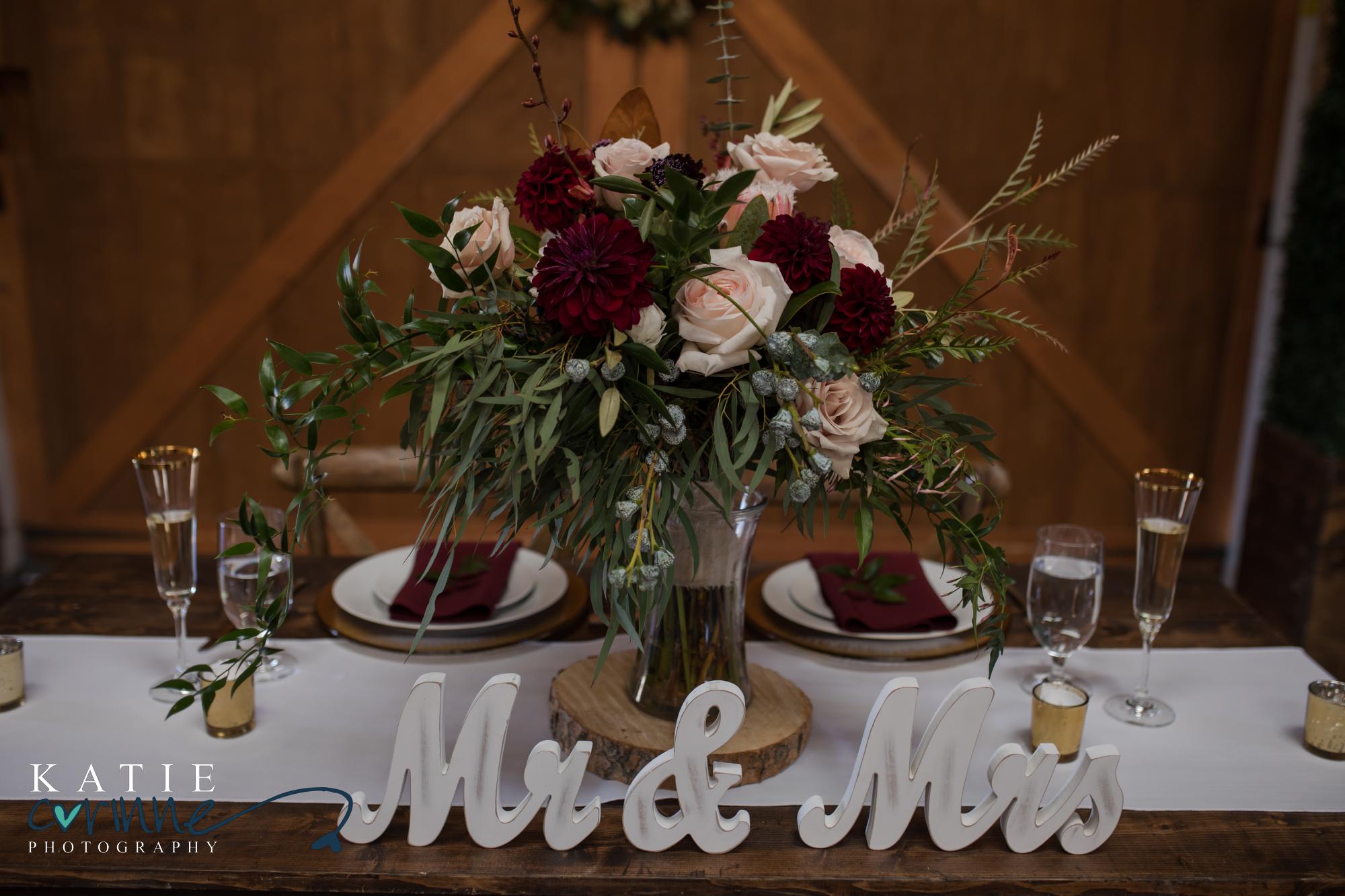 Mr and Mrs signs on newlywed table