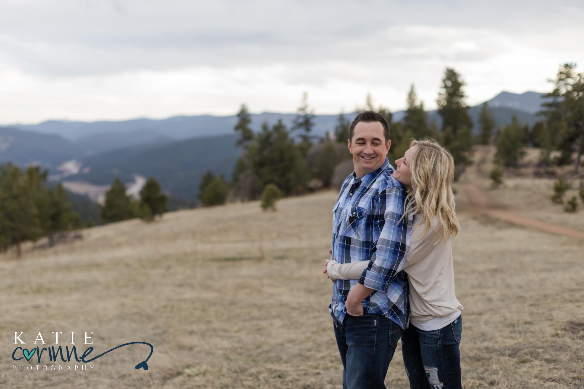 engaged couple hold each other in Morrison Colorado