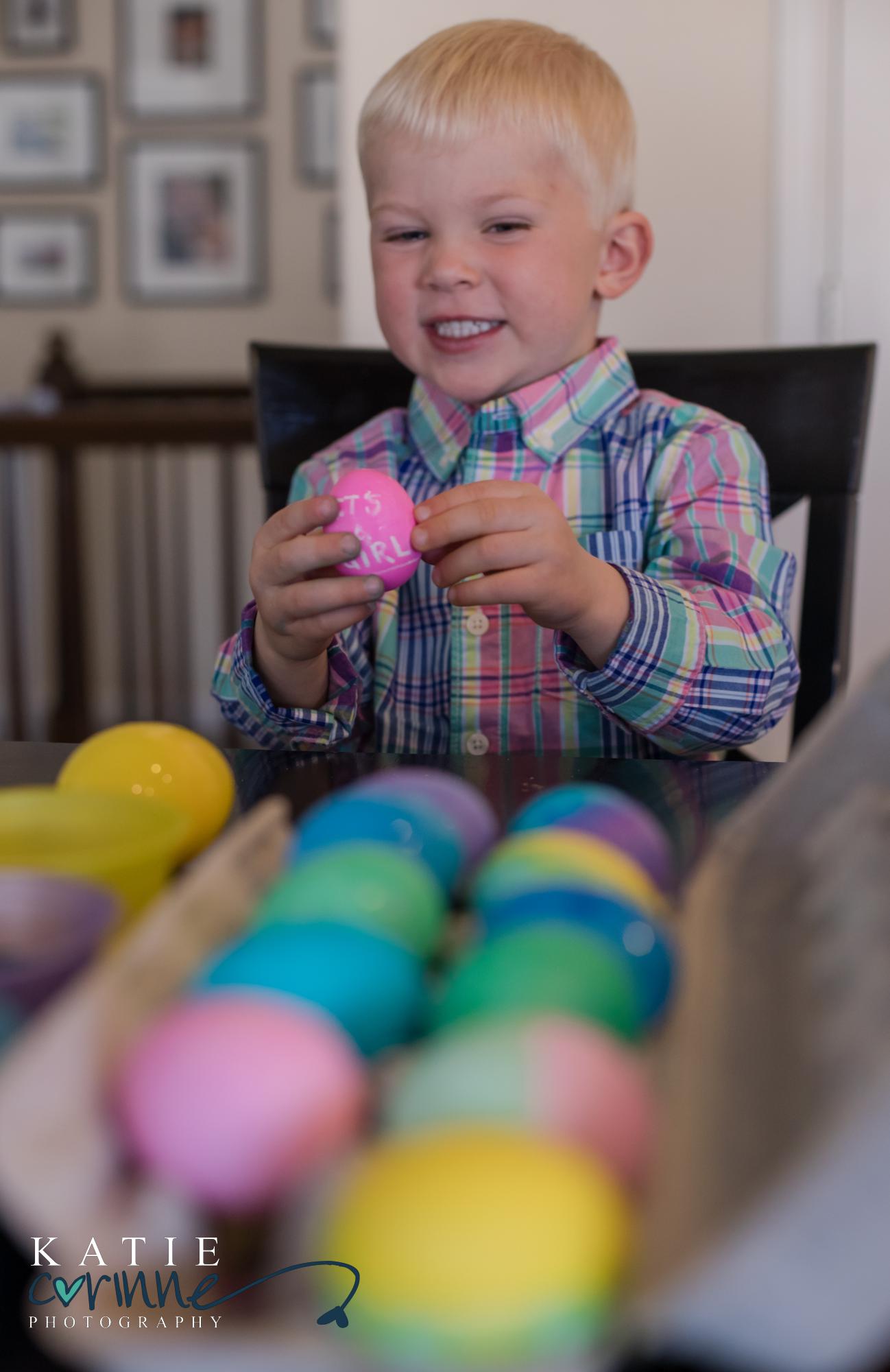 Colorado child sits behind colorful eggs on Easter Sunday