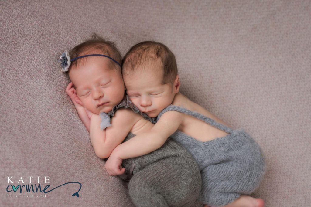Twin newborns sleeping together