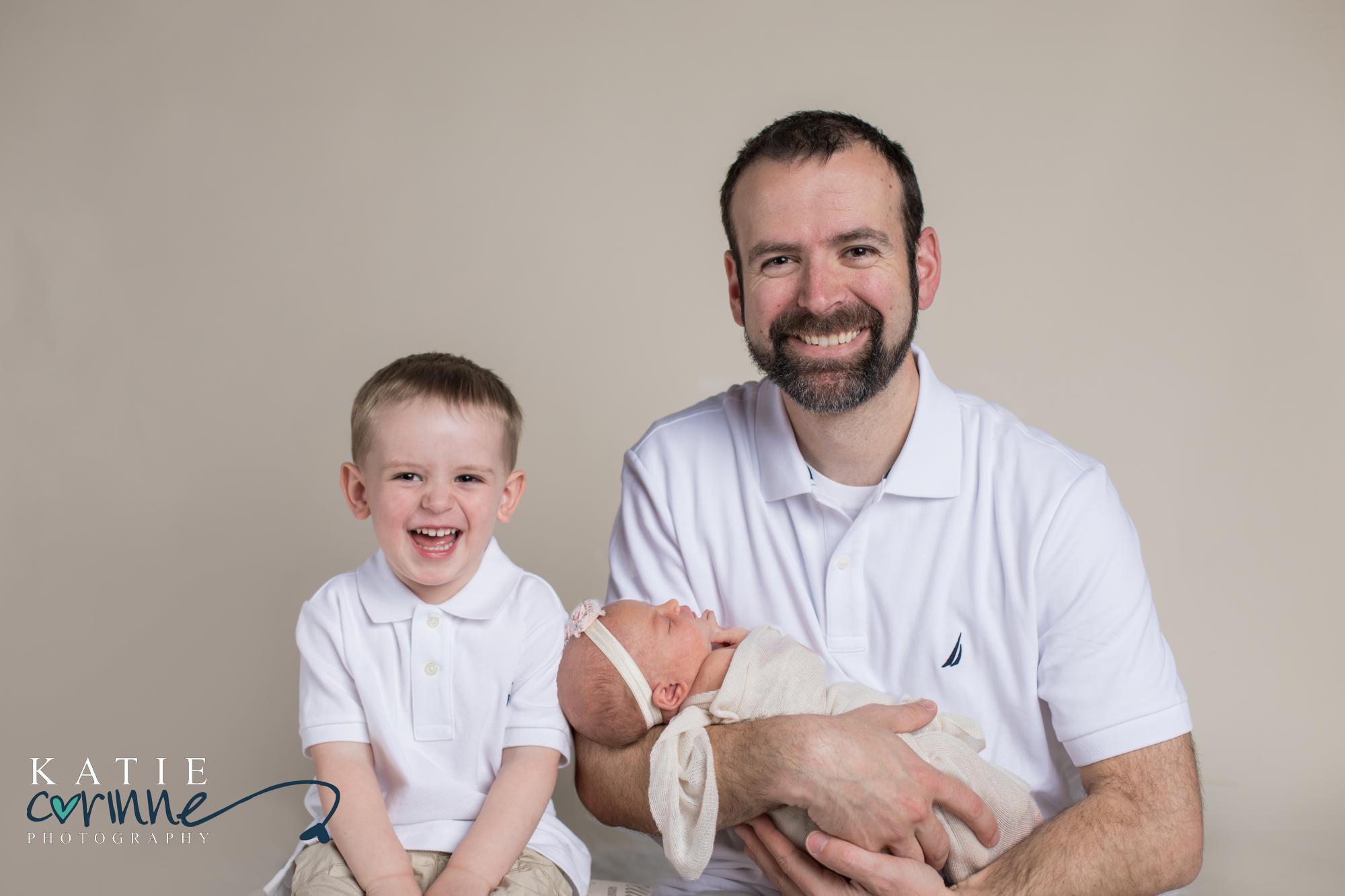 Father, son, and daughter pose for Colorado Springs newborn photographer