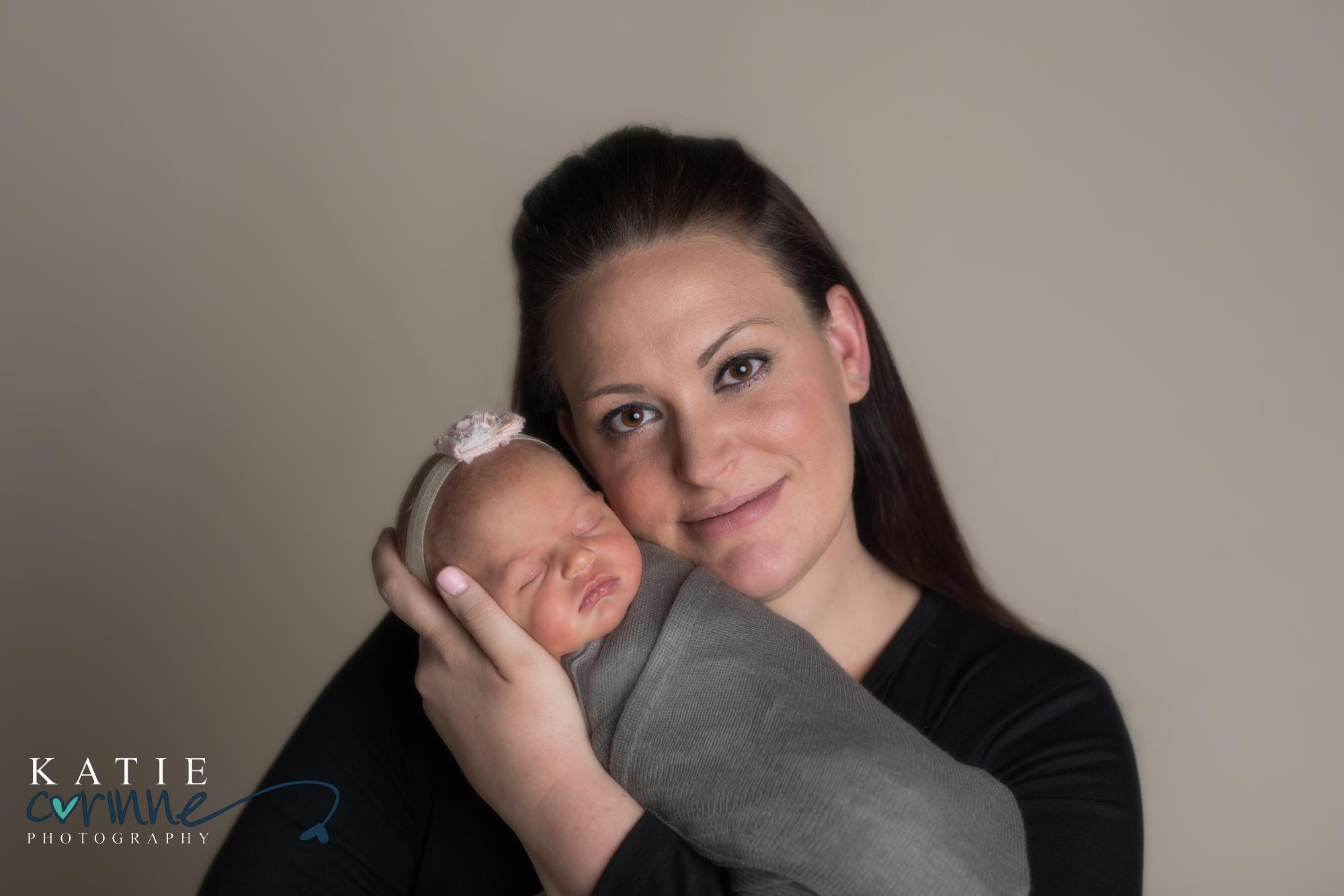 Colorado Mother holds newborn daughter