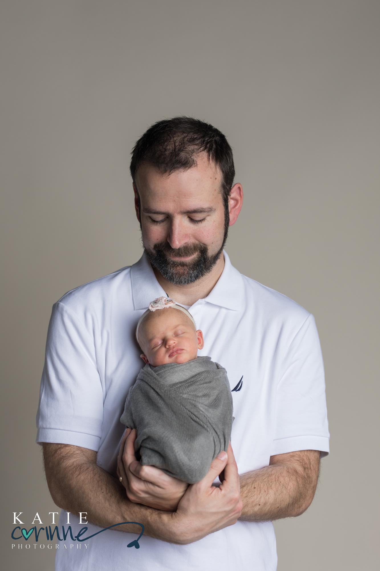 Colorado dad holds newborn daughter