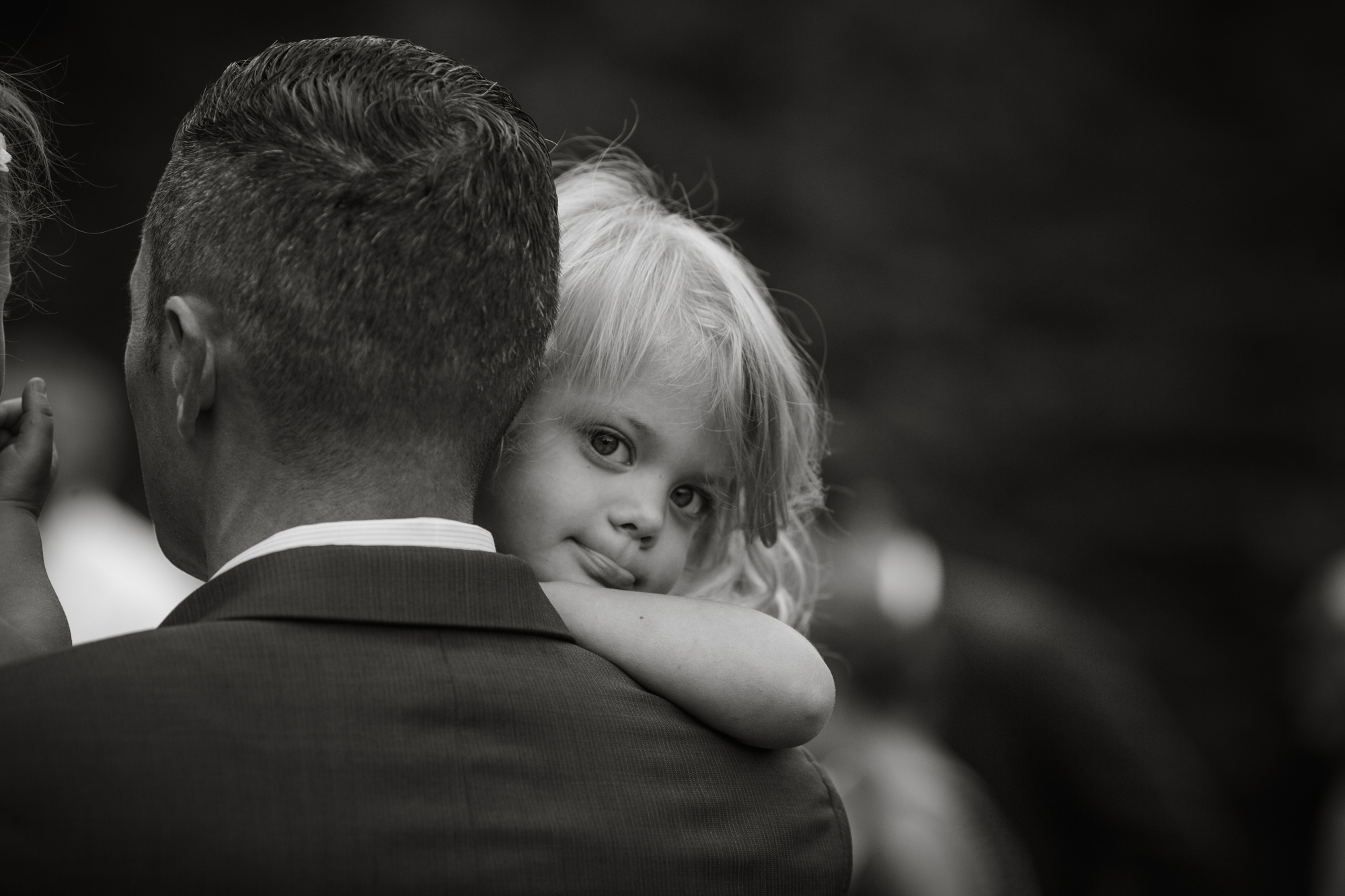 black and white photography of kid at wedding