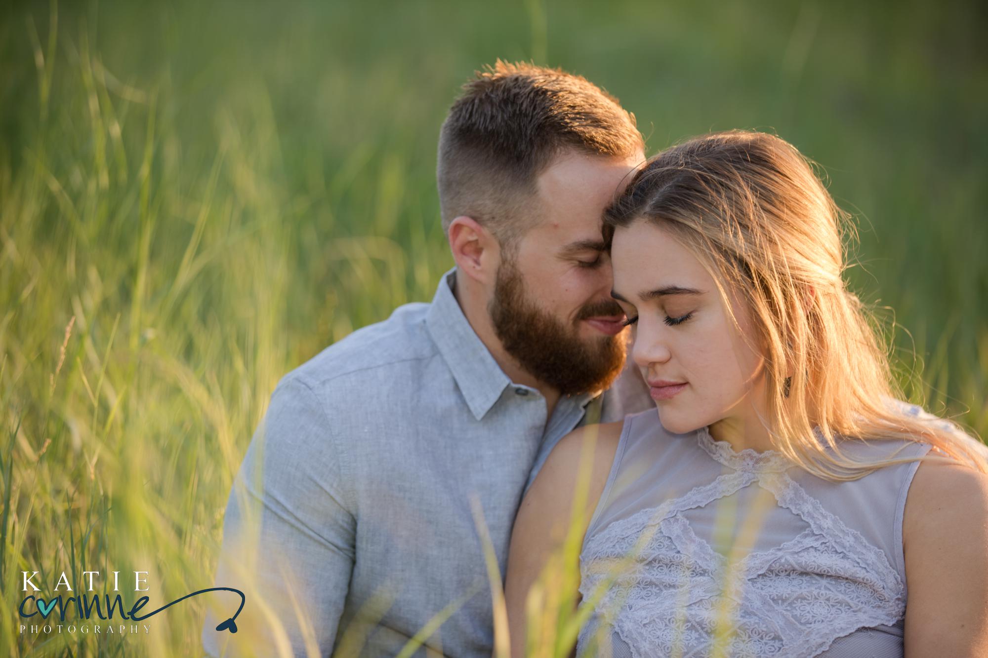 couple poses for Colorado engagement photographer