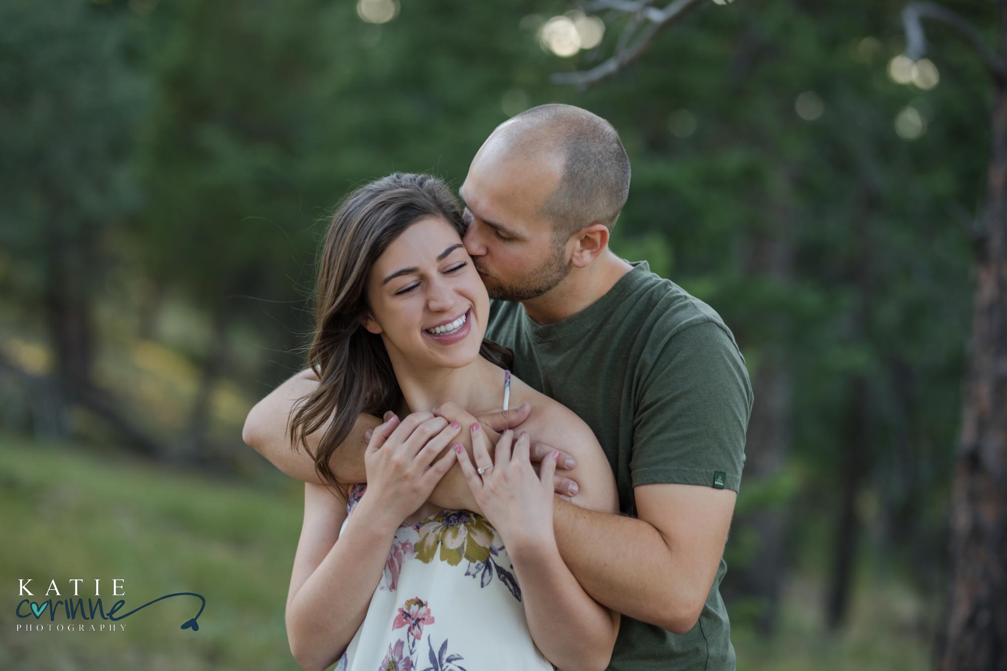 cute couple pose for engagement photographer