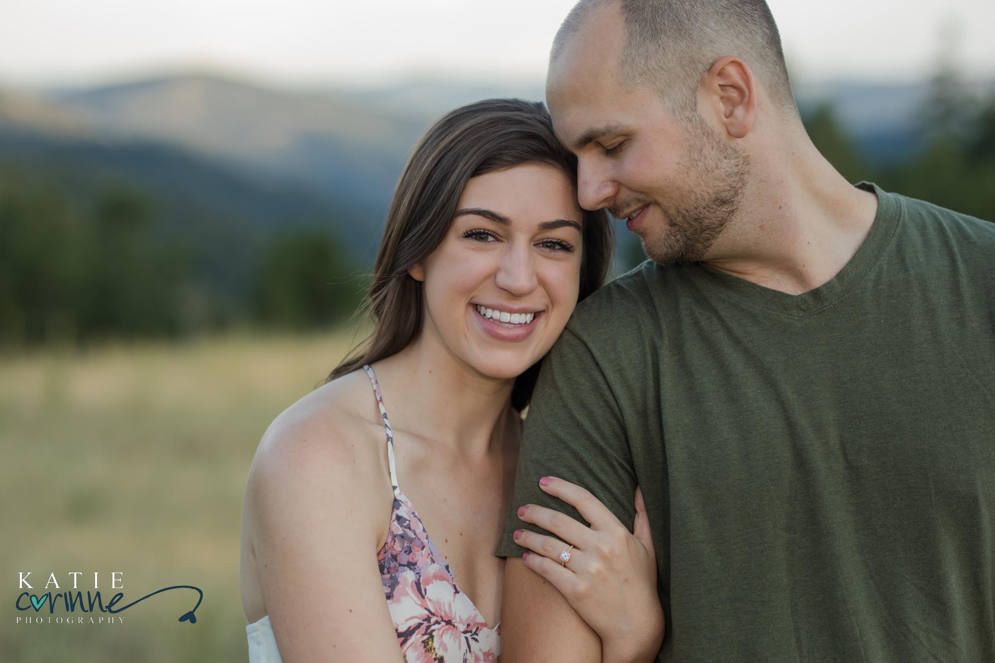 Colorado engaged couple in front of mountains