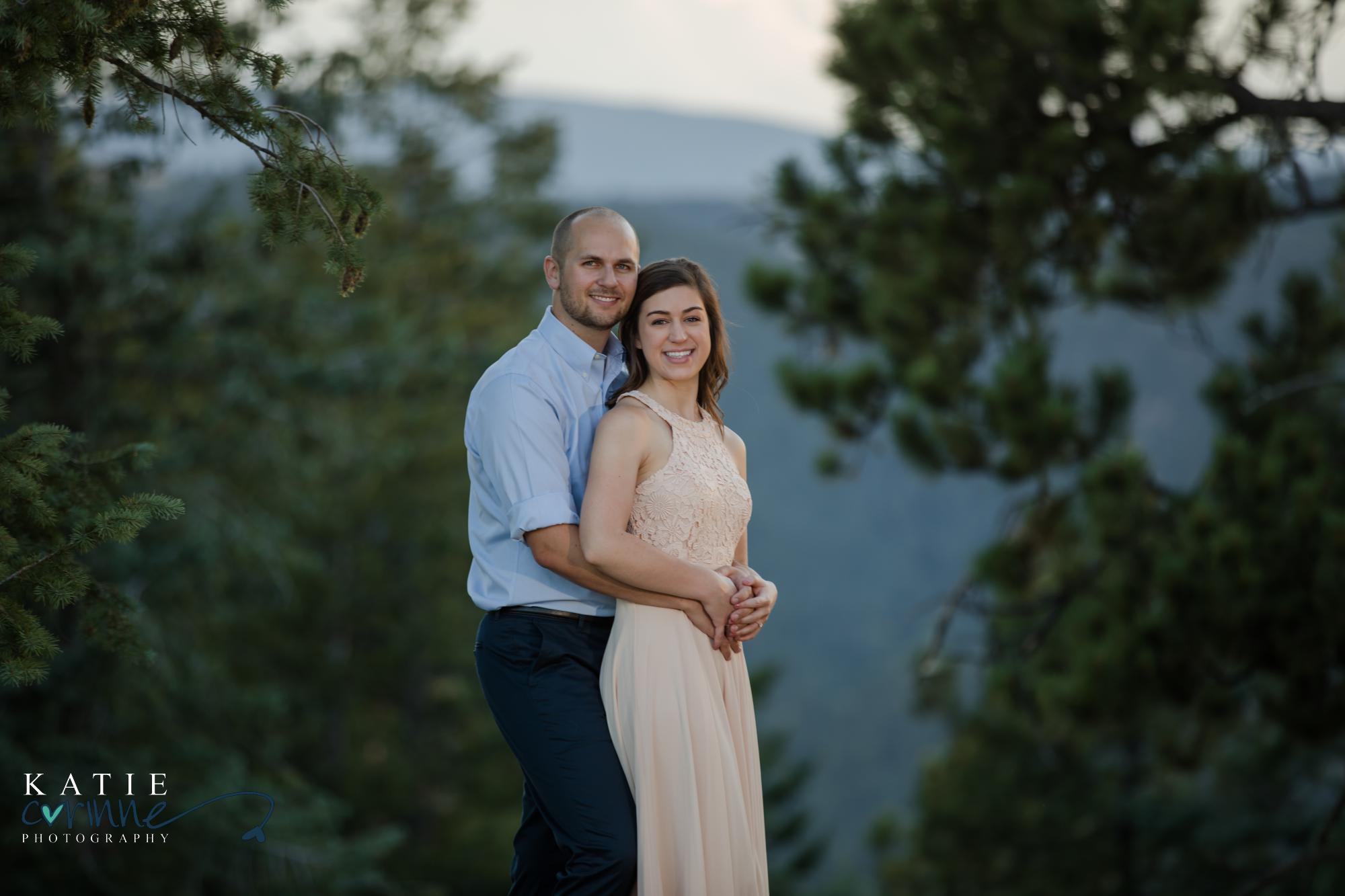 Cute engaged couple at Mt Falcon in Colorado