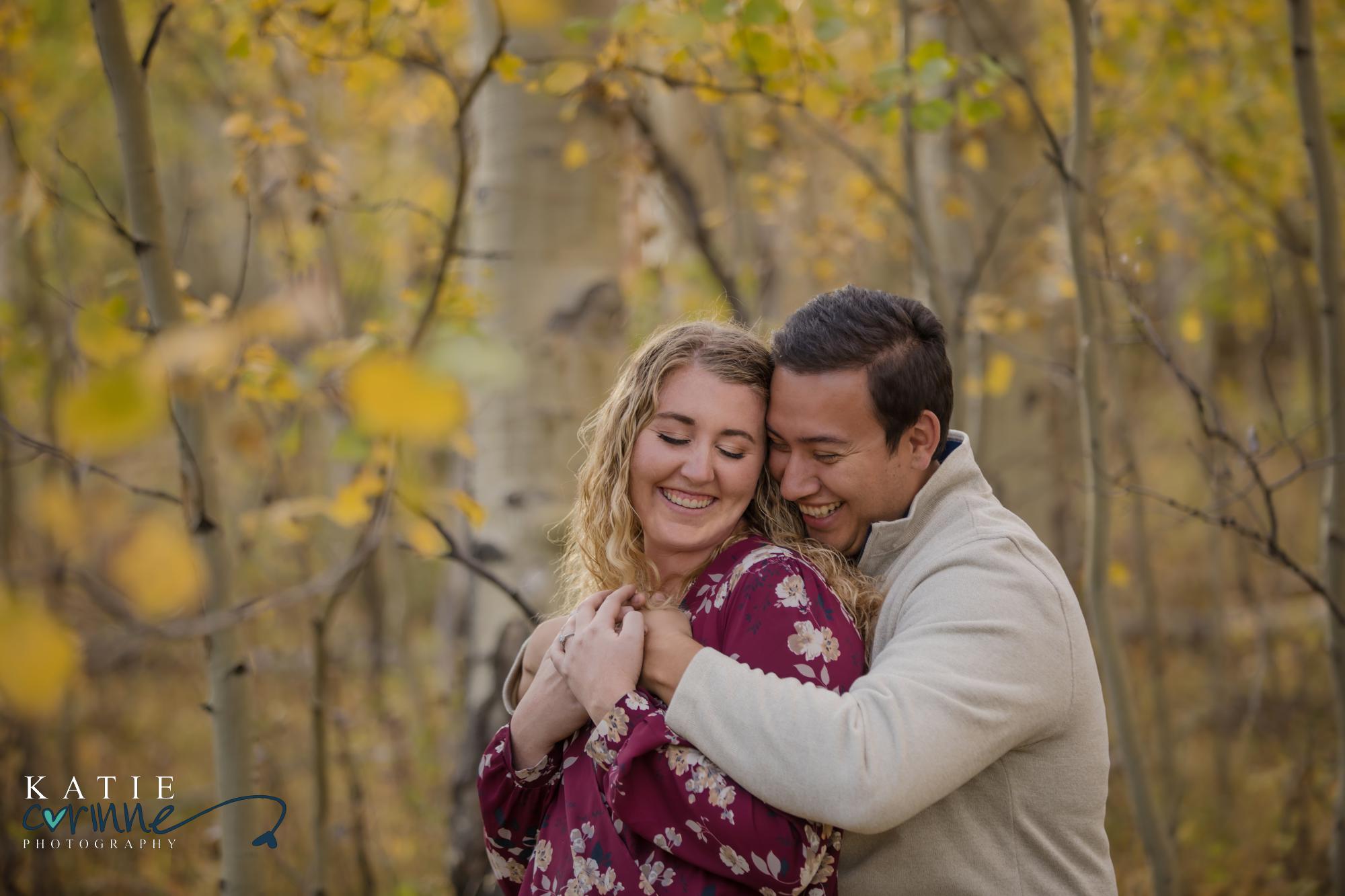 engaged couple in Colorado aspen grove