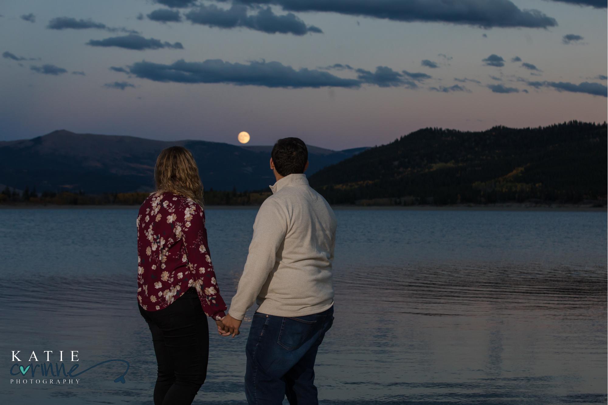 Colorado engaged couple watch moonrise over twin lakes