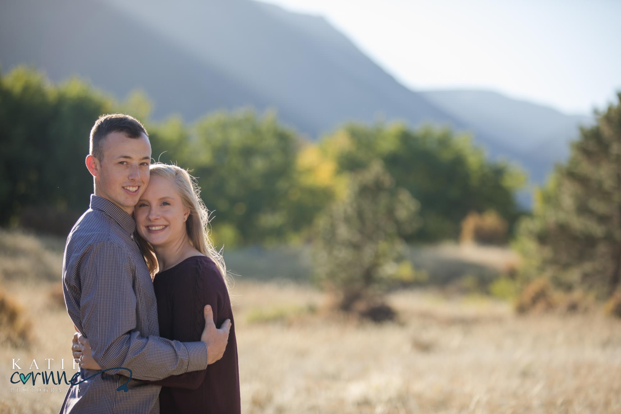 Colorado engaged couple in front of rocky mountains