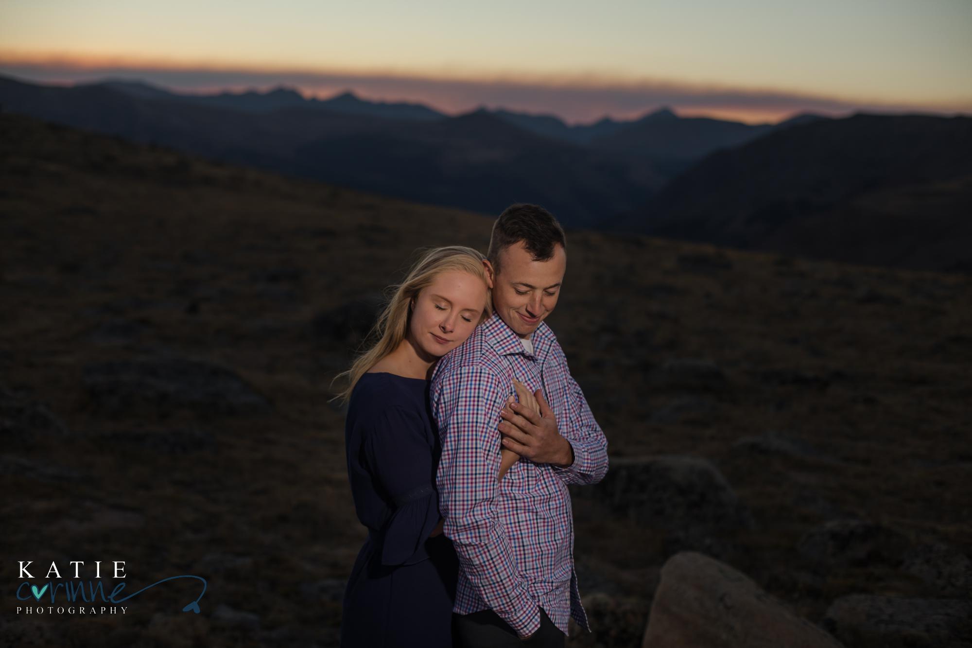 couple poses for engagement session on trail ridge road