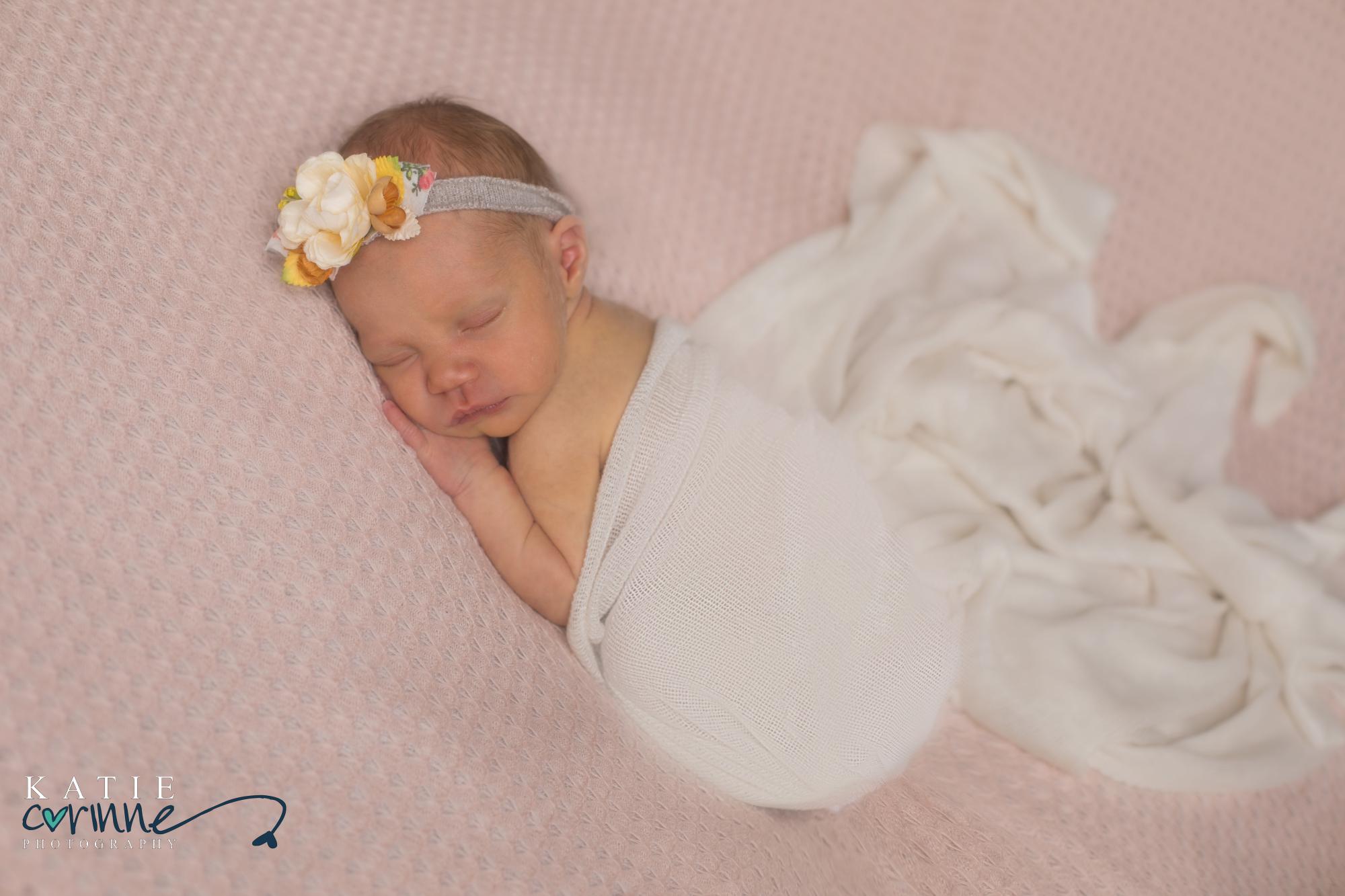 Newborn photographer take portraits of sweet baby girl