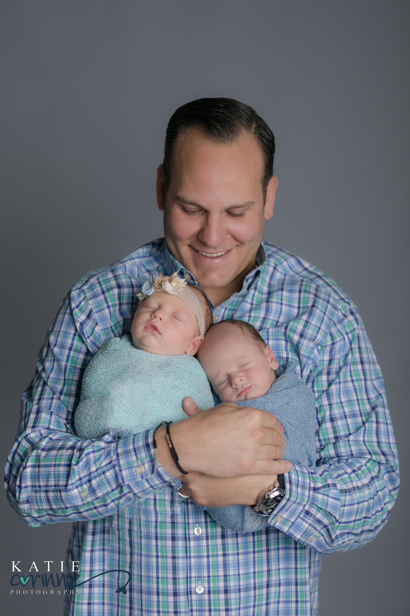 Colorado father with newborn twins in palmer springs photo studio