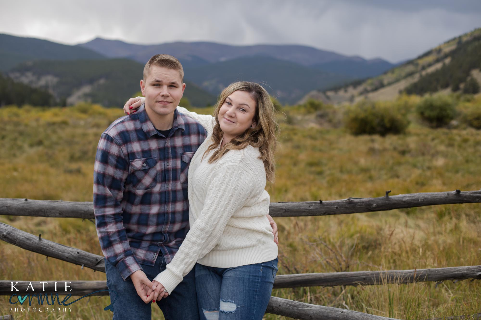 couple in front of rocky mountains during engagement session