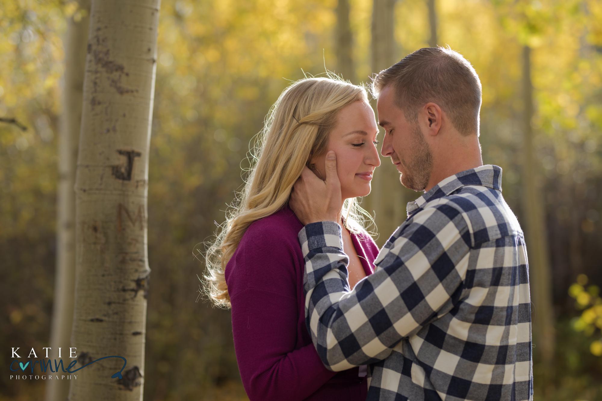 couple holding each other in Colorado woods