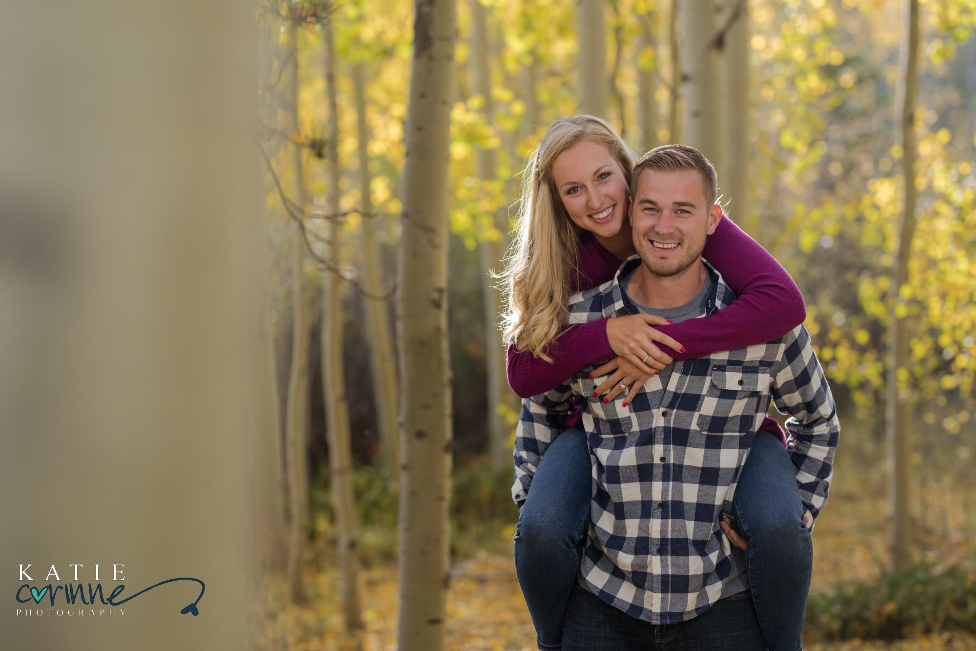 couple poses for Colorado photographer
